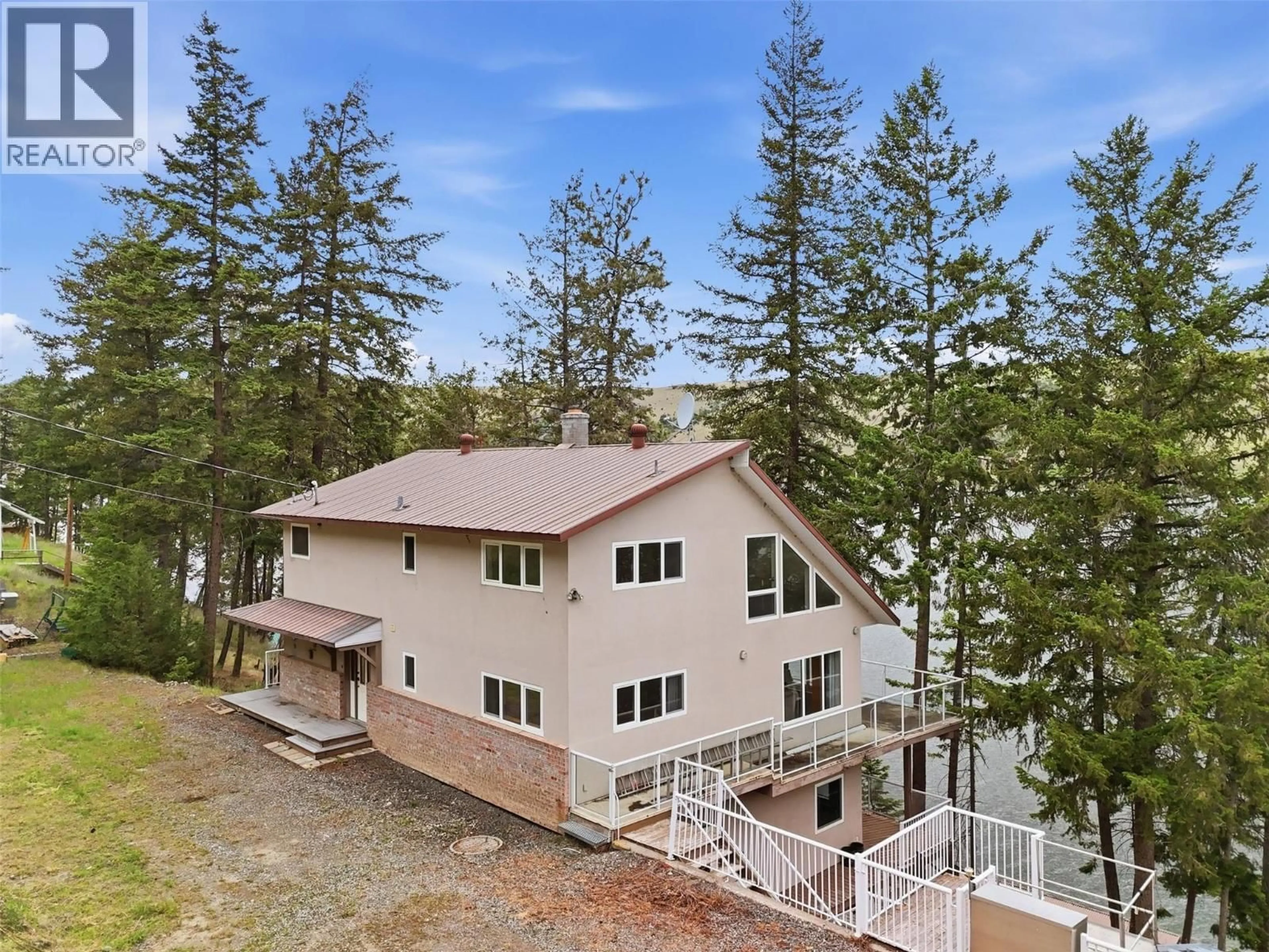 A pic from outside/outdoor area/front of a property/back of a property/a pic from drone, water/lake/river/ocean view for 9067 PLANET MINE ROAD, Stump Lake British Columbia V0E1S0