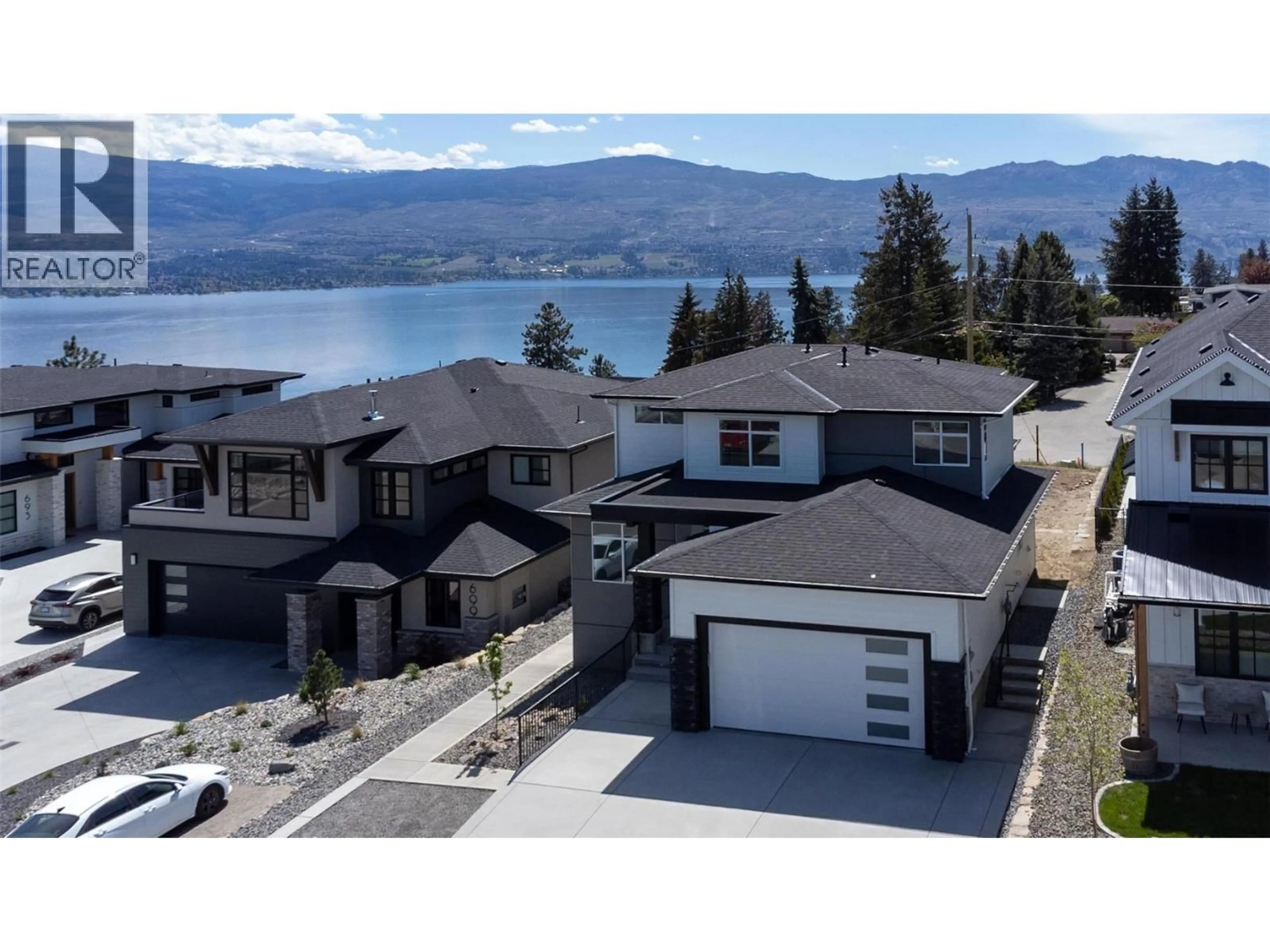 A pic from outside/outdoor area/front of a property/back of a property/a pic from drone, water/lake/river/ocean view for 703 LAKE COURT, West Kelowna British Columbia V1Z1H6