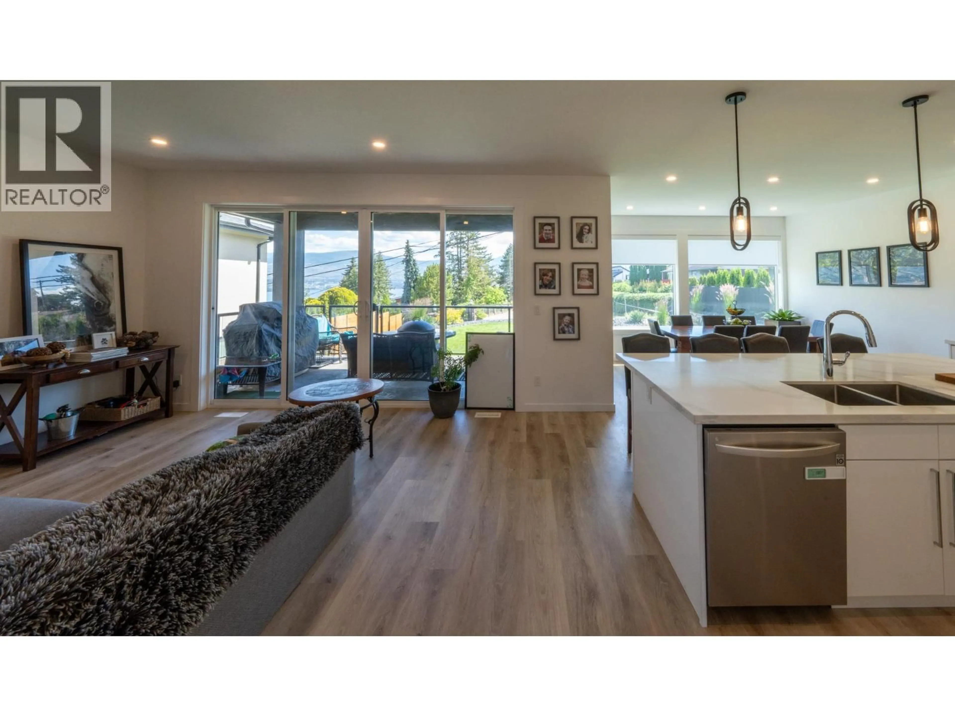 Open concept kitchen, wood/laminate floor for 703 LAKE COURT, West Kelowna British Columbia V1Z1H6