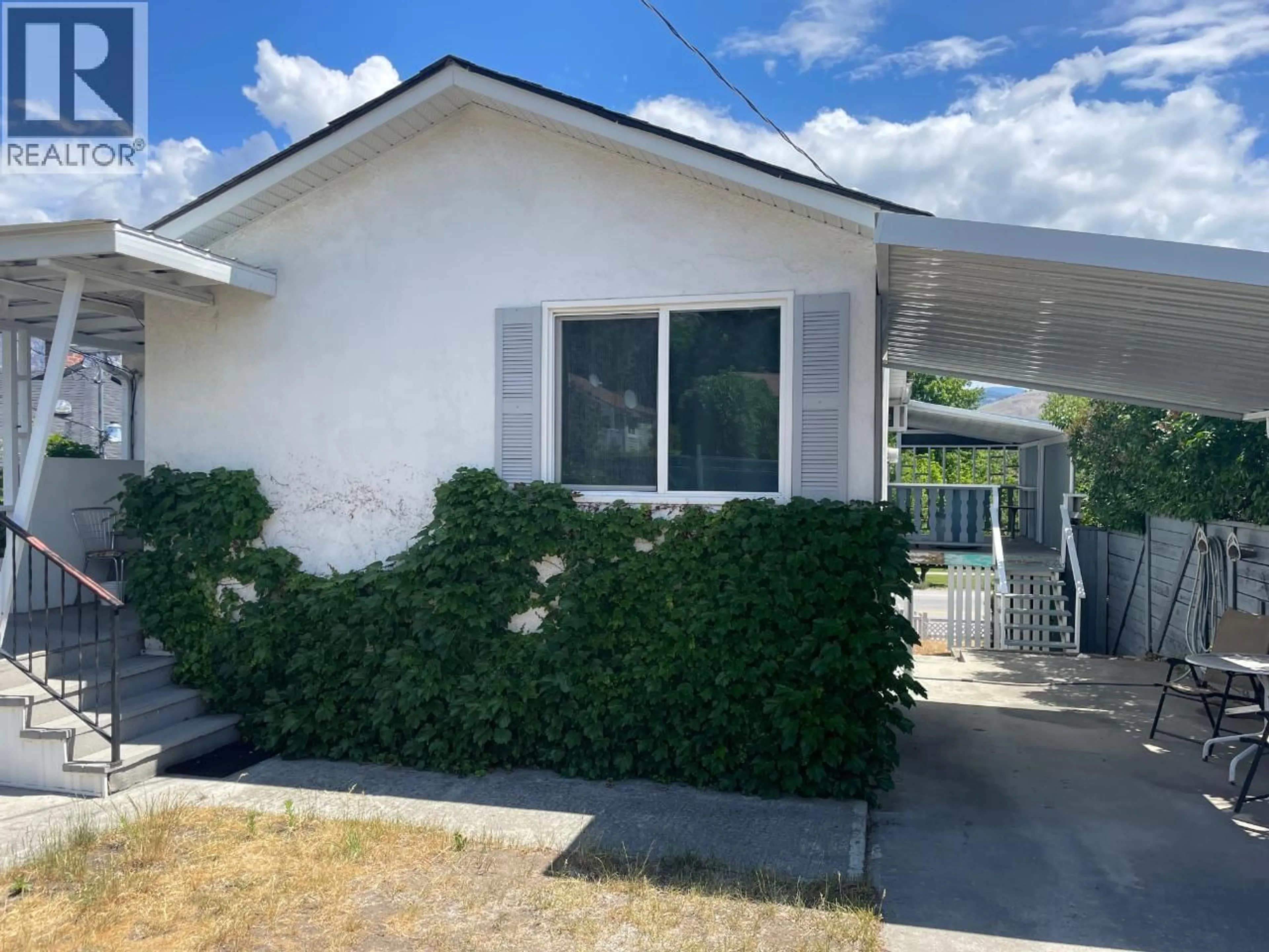 Home with vinyl exterior material, street for 6528 MAIN STREET, Oliver British Columbia V0H1T0