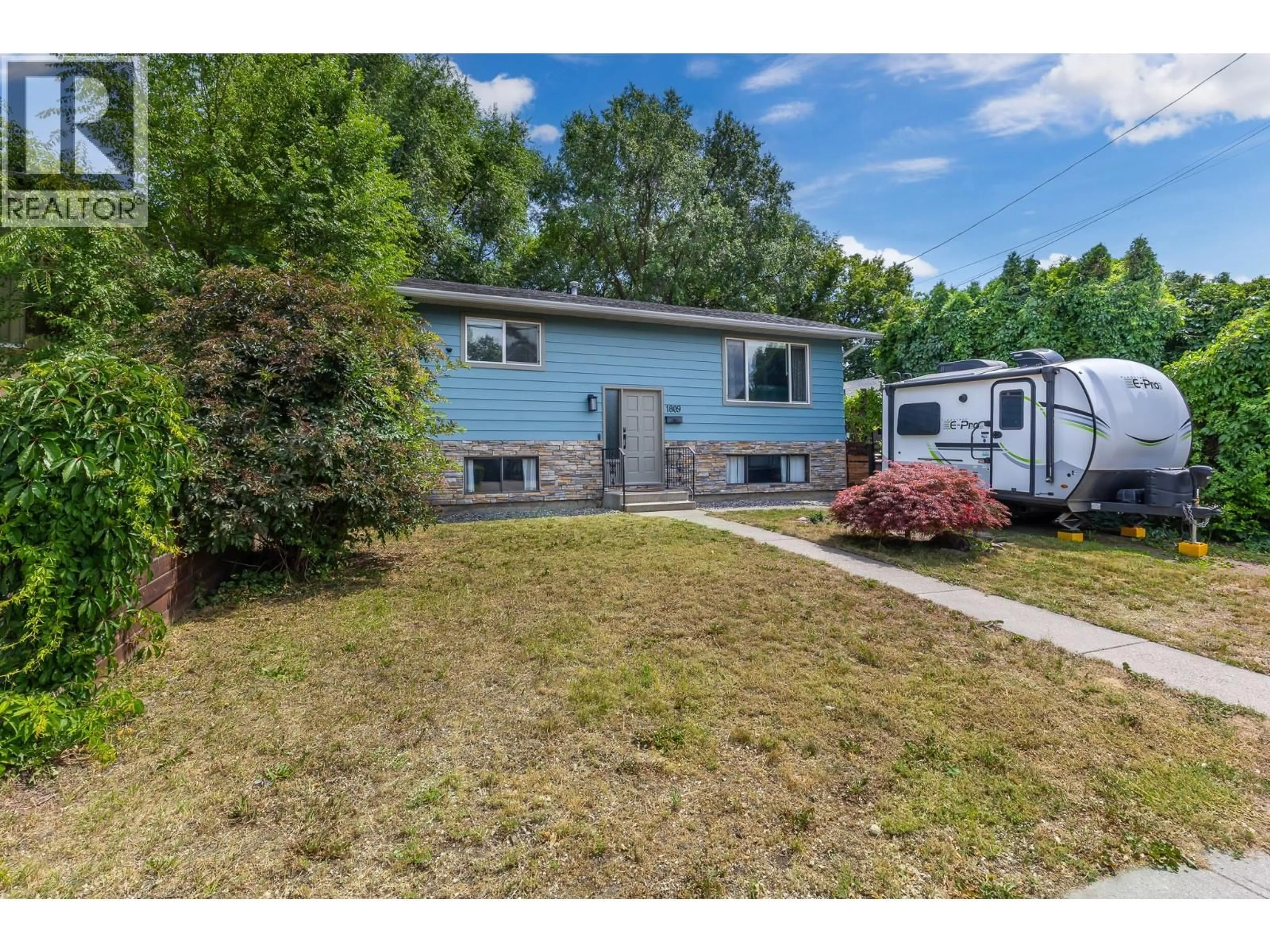 Home with vinyl exterior material, street for 1809 44 STREET, Vernon British Columbia V1T7S2
