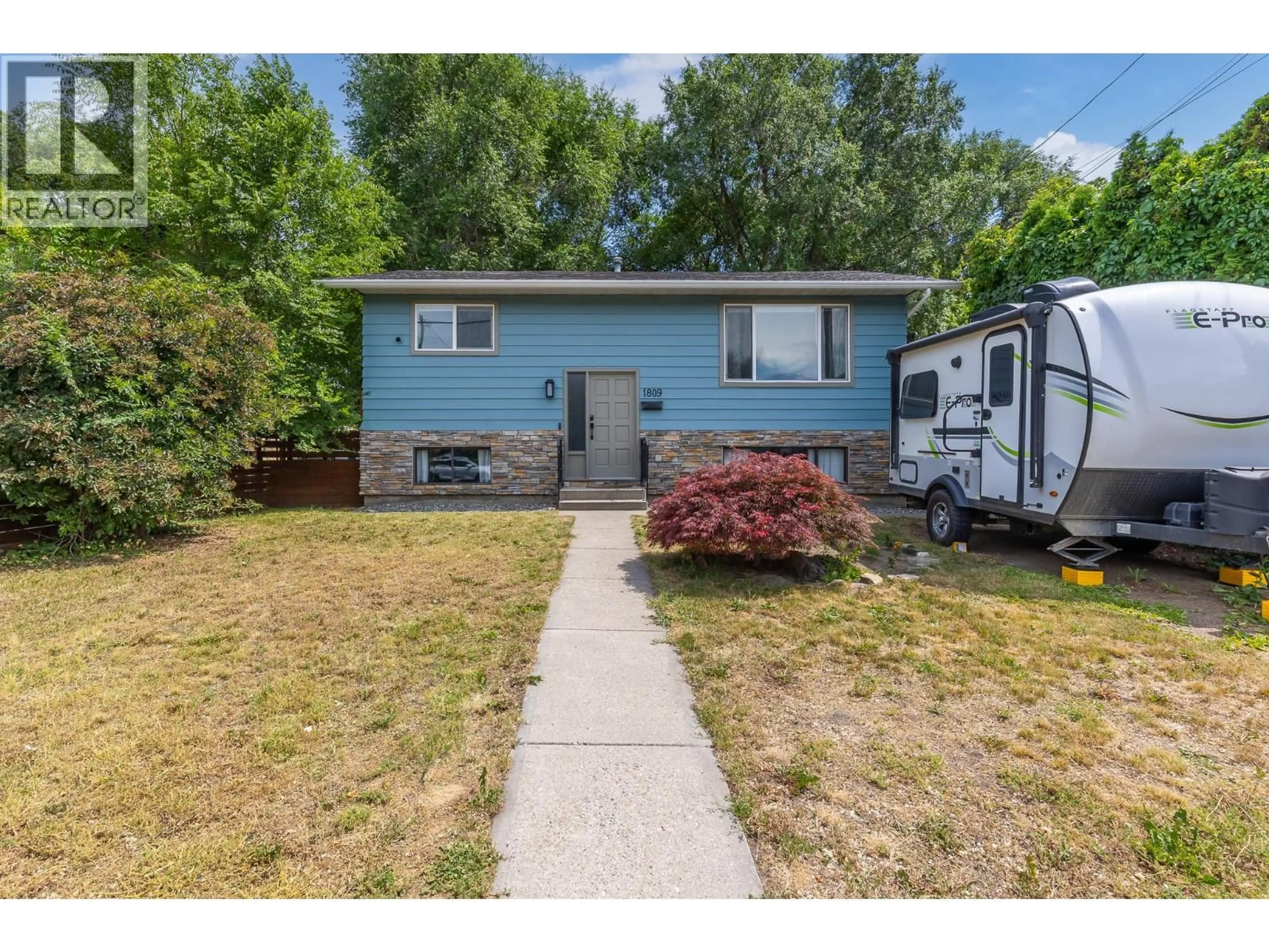 Home with vinyl exterior material, street for 1809 44 STREET, Vernon British Columbia V1T7S2