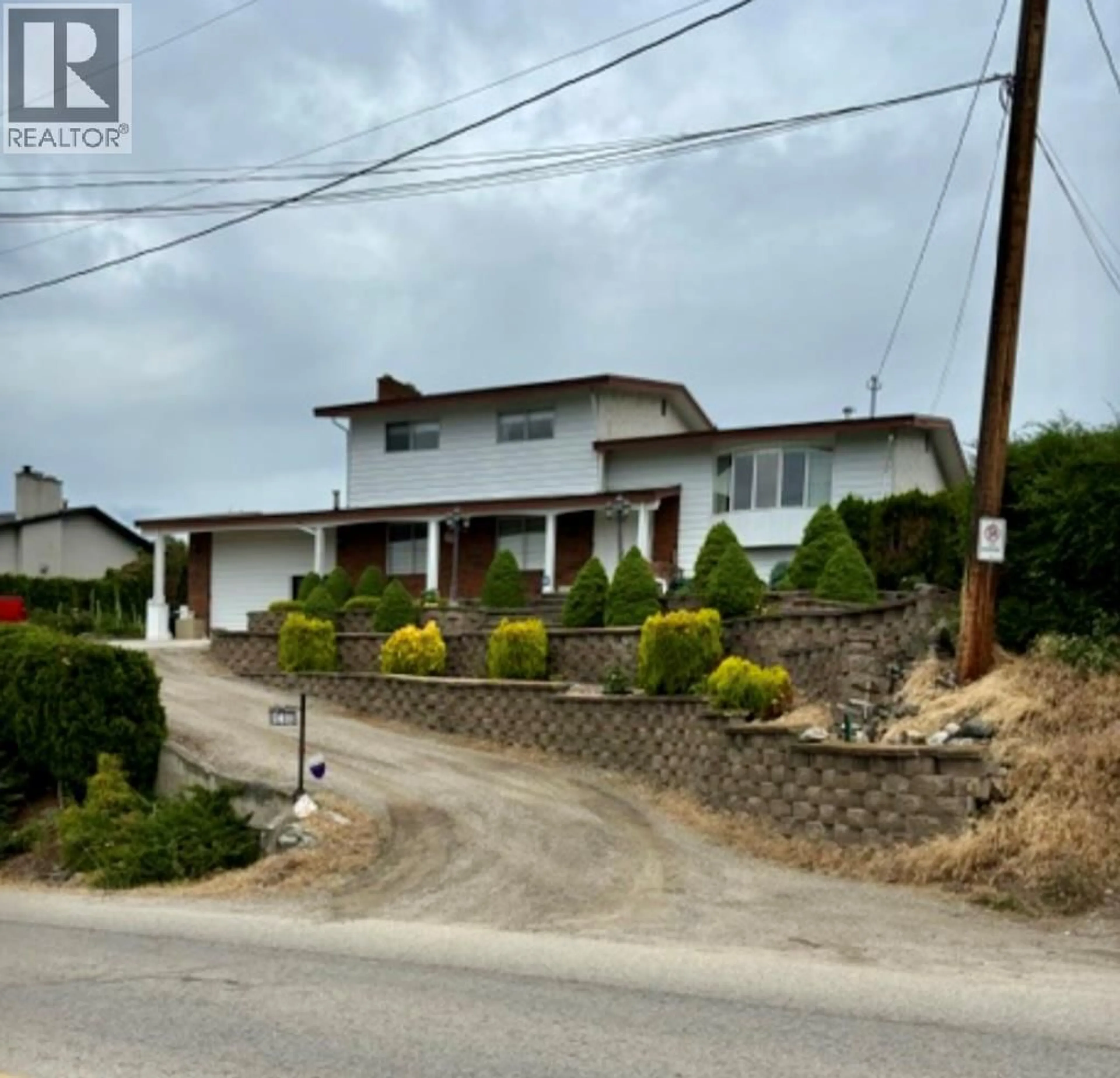 A pic from outside/outdoor area/front of a property/back of a property/a pic from drone, street for 838 MCKENZIE ROAD, Kelowna British Columbia V1X2B3