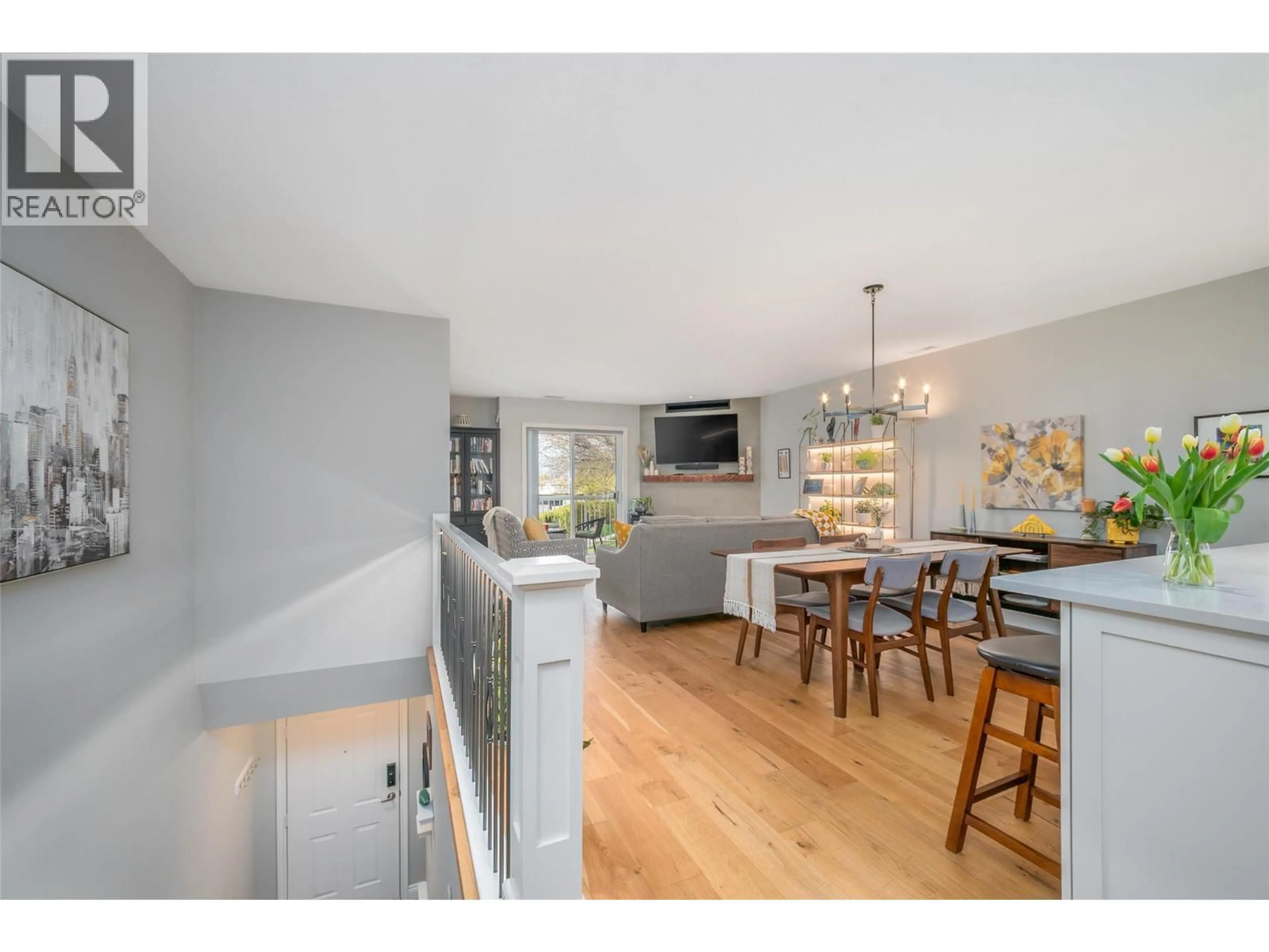 Open concept kitchen, wood/laminate floor for 216 - 2350 STILLINGFLEET ROAD, Kelowna British Columbia V1W3X9