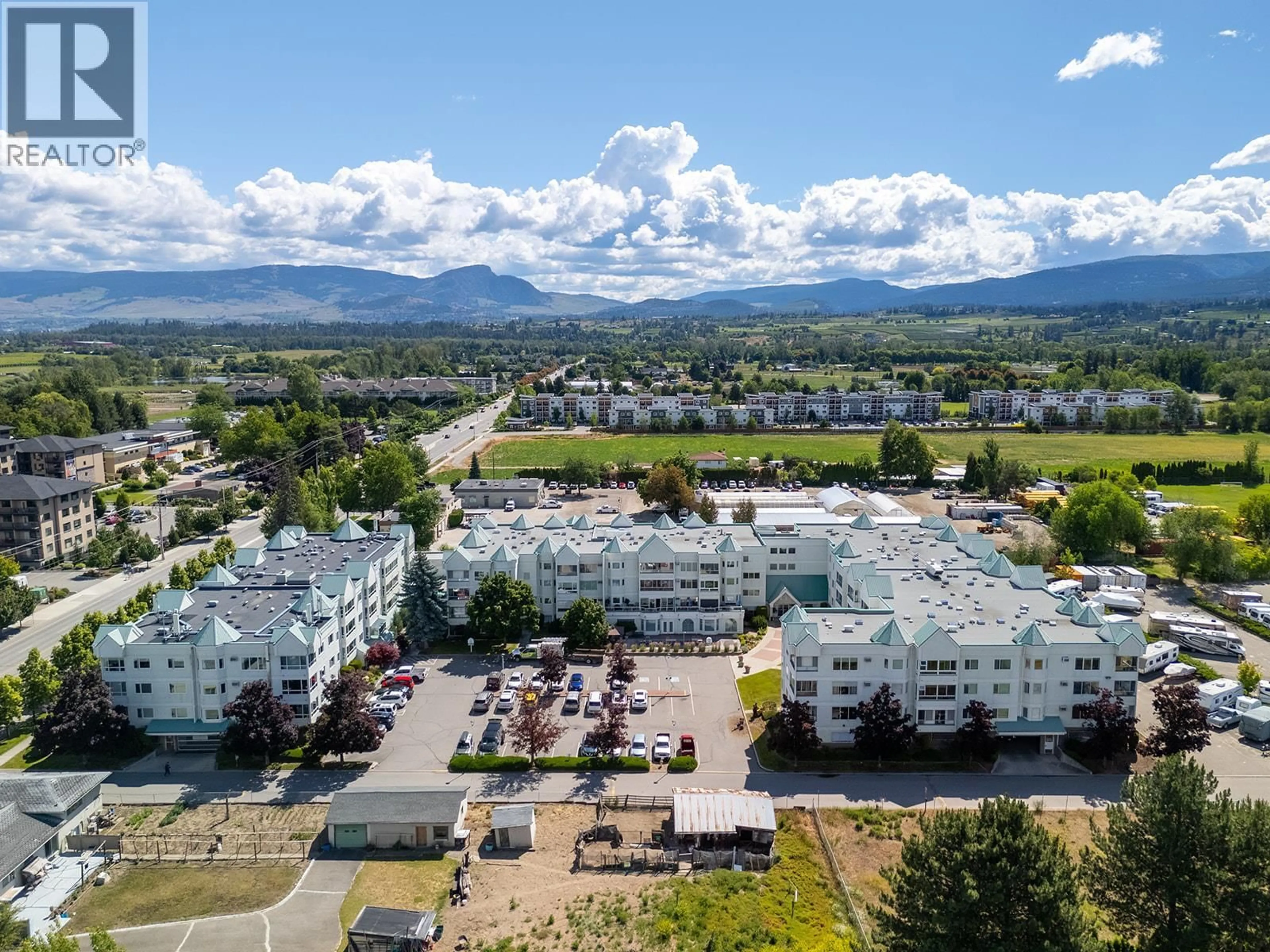 A pic from outside/outdoor area/front of a property/back of a property/a pic from drone, mountain view for 316 - 1329 KLO ROAD, Kelowna British Columbia V1W3N9