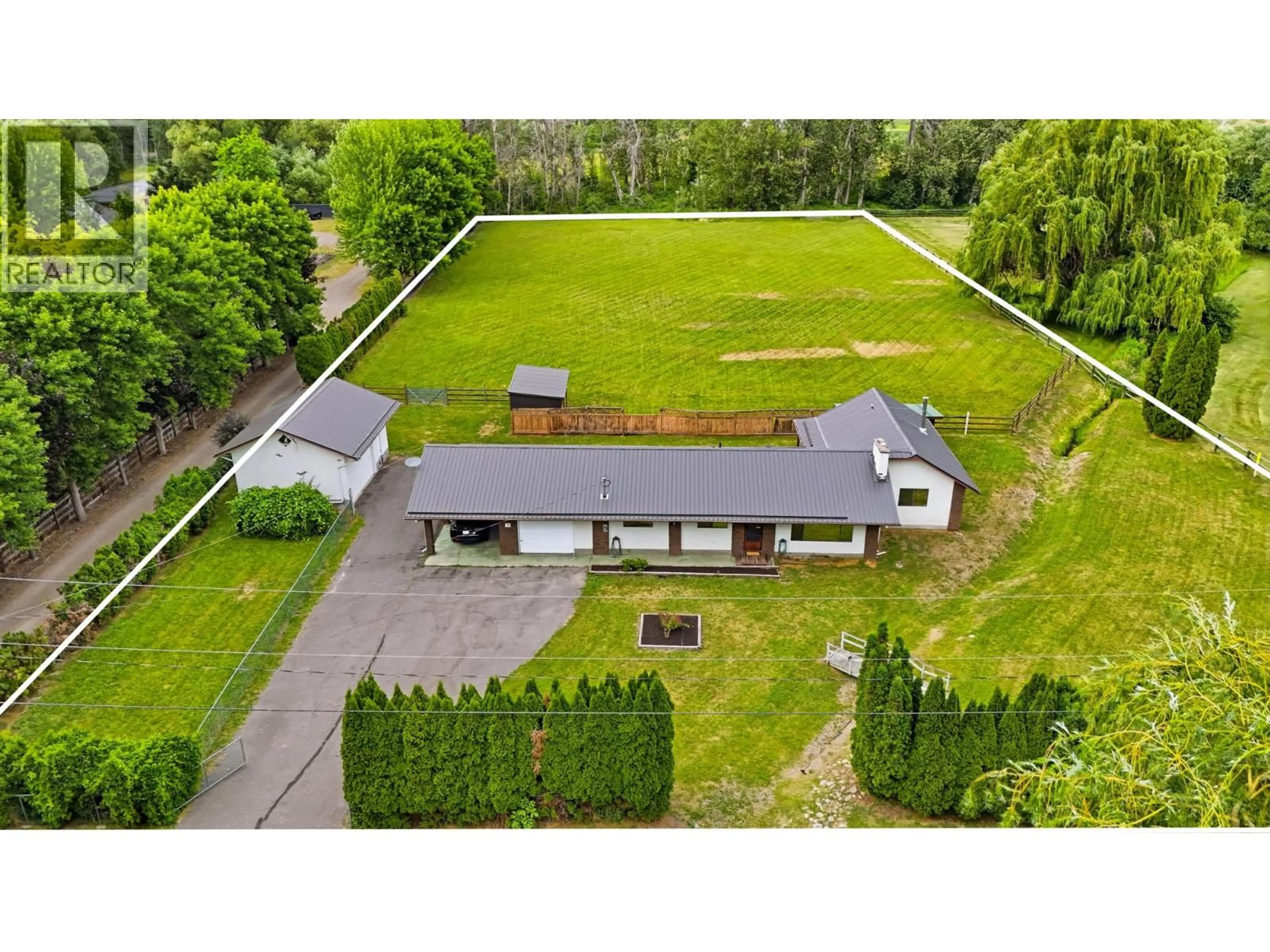 A pic from outside/outdoor area/front of a property/back of a property/a pic from drone, building for 1988 HEIMLICH ROAD, Kelowna British Columbia V1W4A8