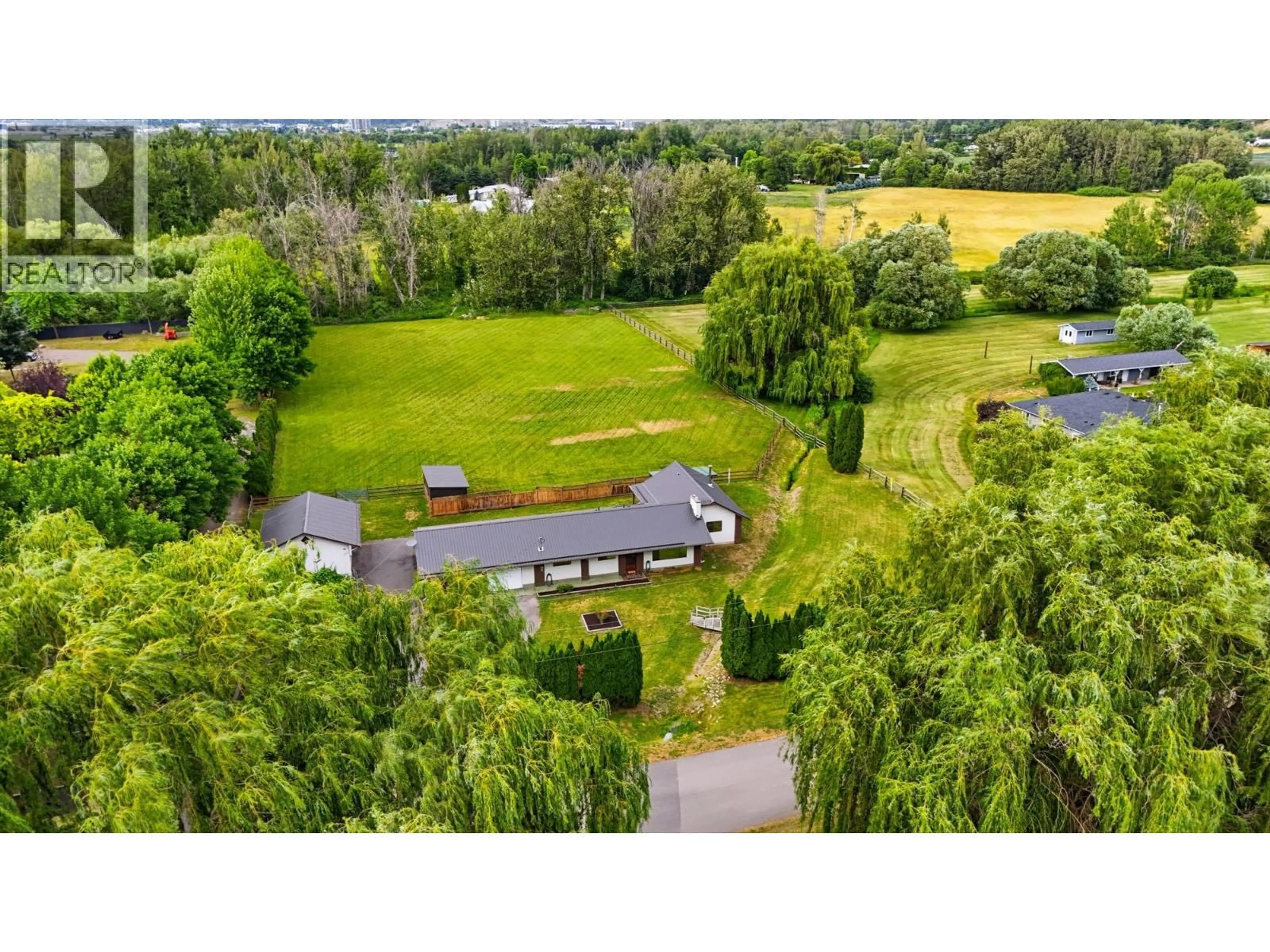 A pic from outside/outdoor area/front of a property/back of a property/a pic from drone, unknown for 1988 HEIMLICH ROAD, Kelowna British Columbia V1W4A8