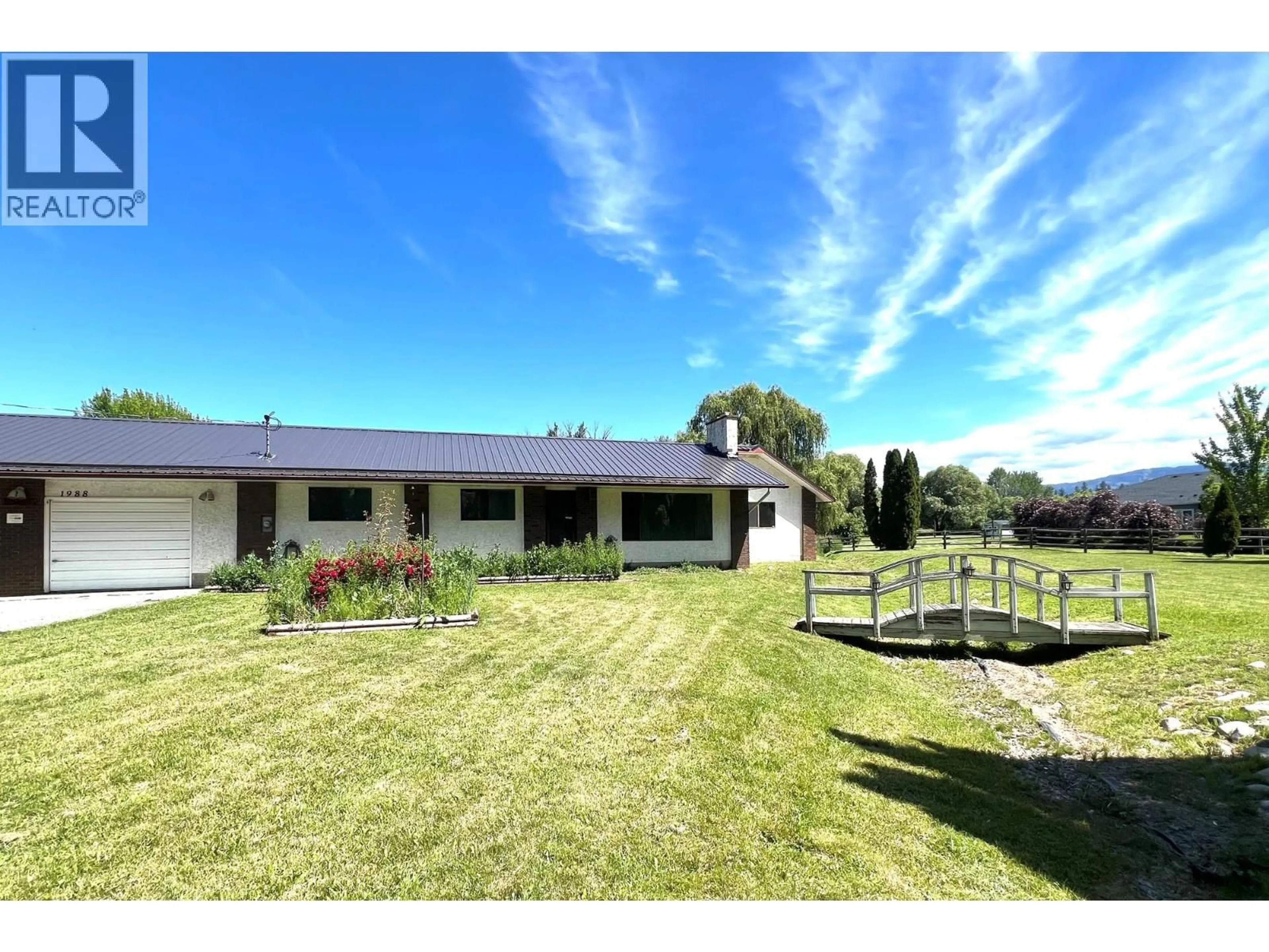 A pic from outside/outdoor area/front of a property/back of a property/a pic from drone, mountain view for 1988 HEIMLICH ROAD, Kelowna British Columbia V1W4A8