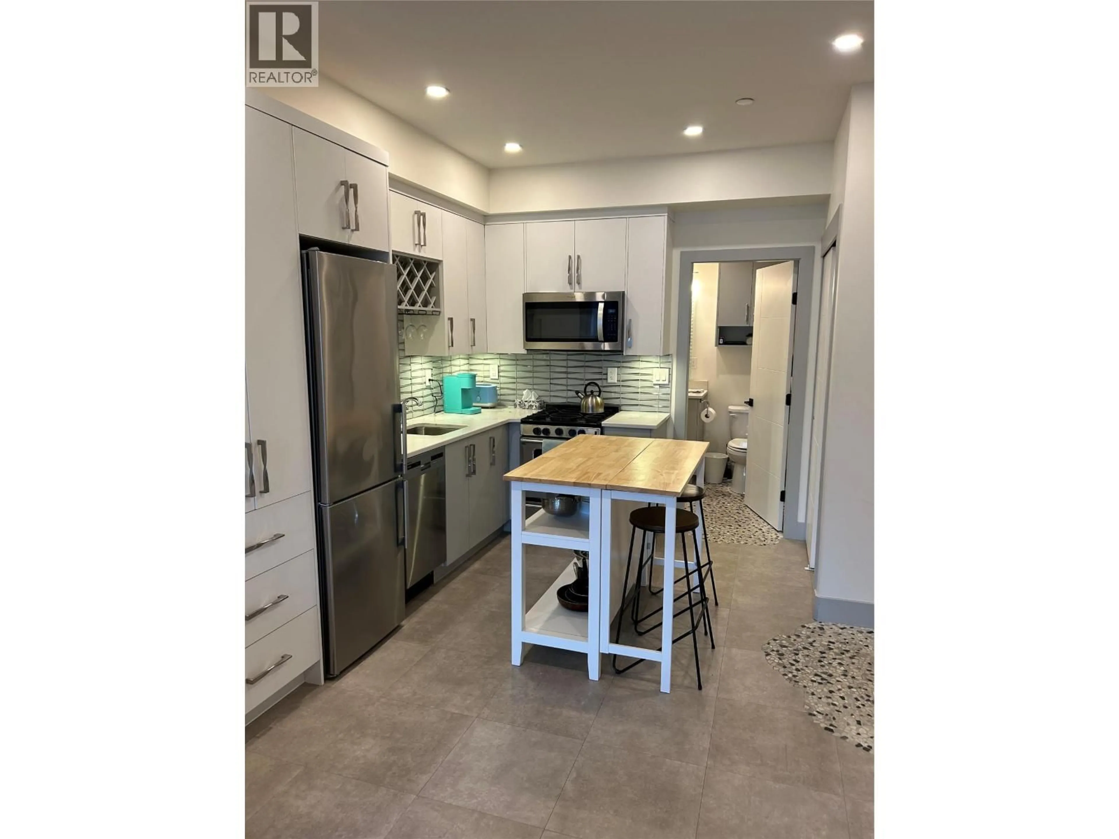 Open concept kitchen, ceramic/tile floor for 210 - 3475 GRANITE CLOSE CLOSE, Kelowna British Columbia V1V0B9