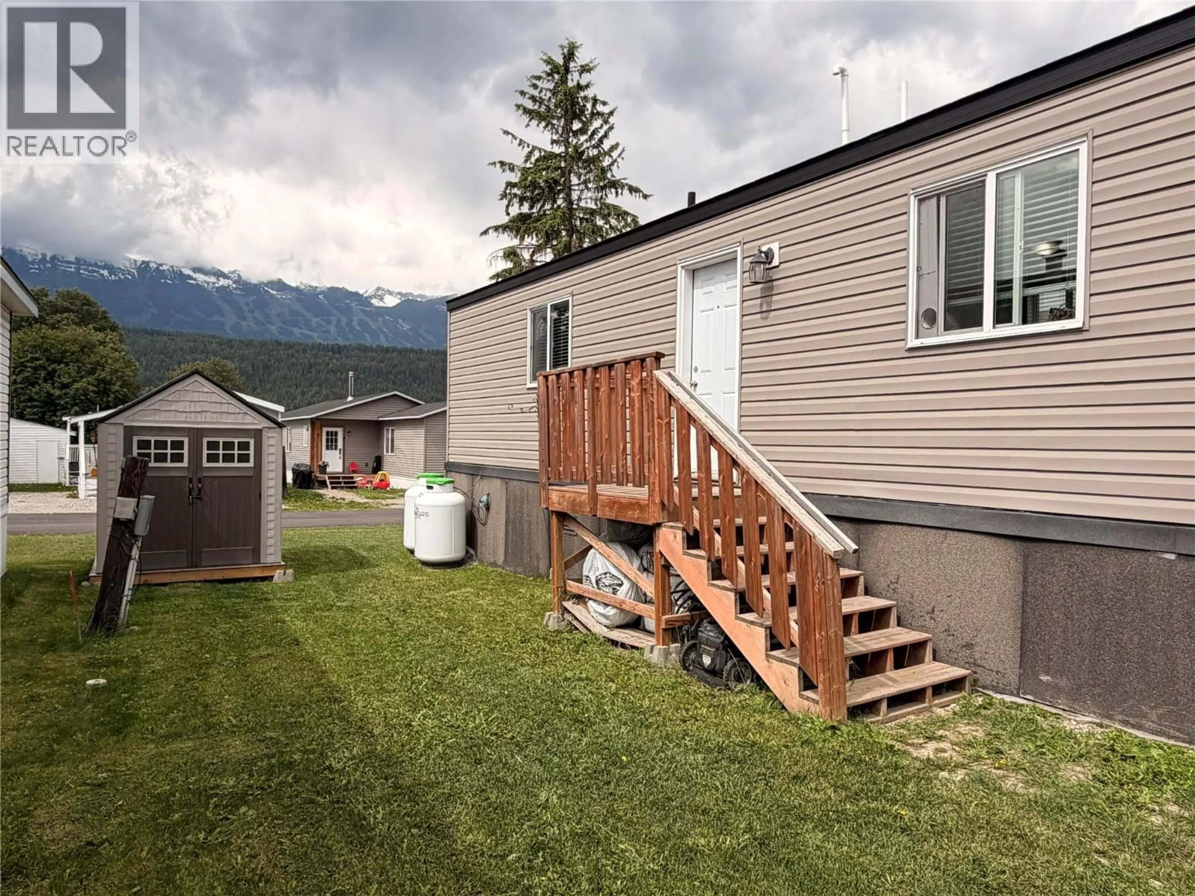 A pic from outside/outdoor area/front of a property/back of a property/a pic from drone, mountain view for 5 - 1117 10TH AVENUE, Golden British Columbia V0A1H2