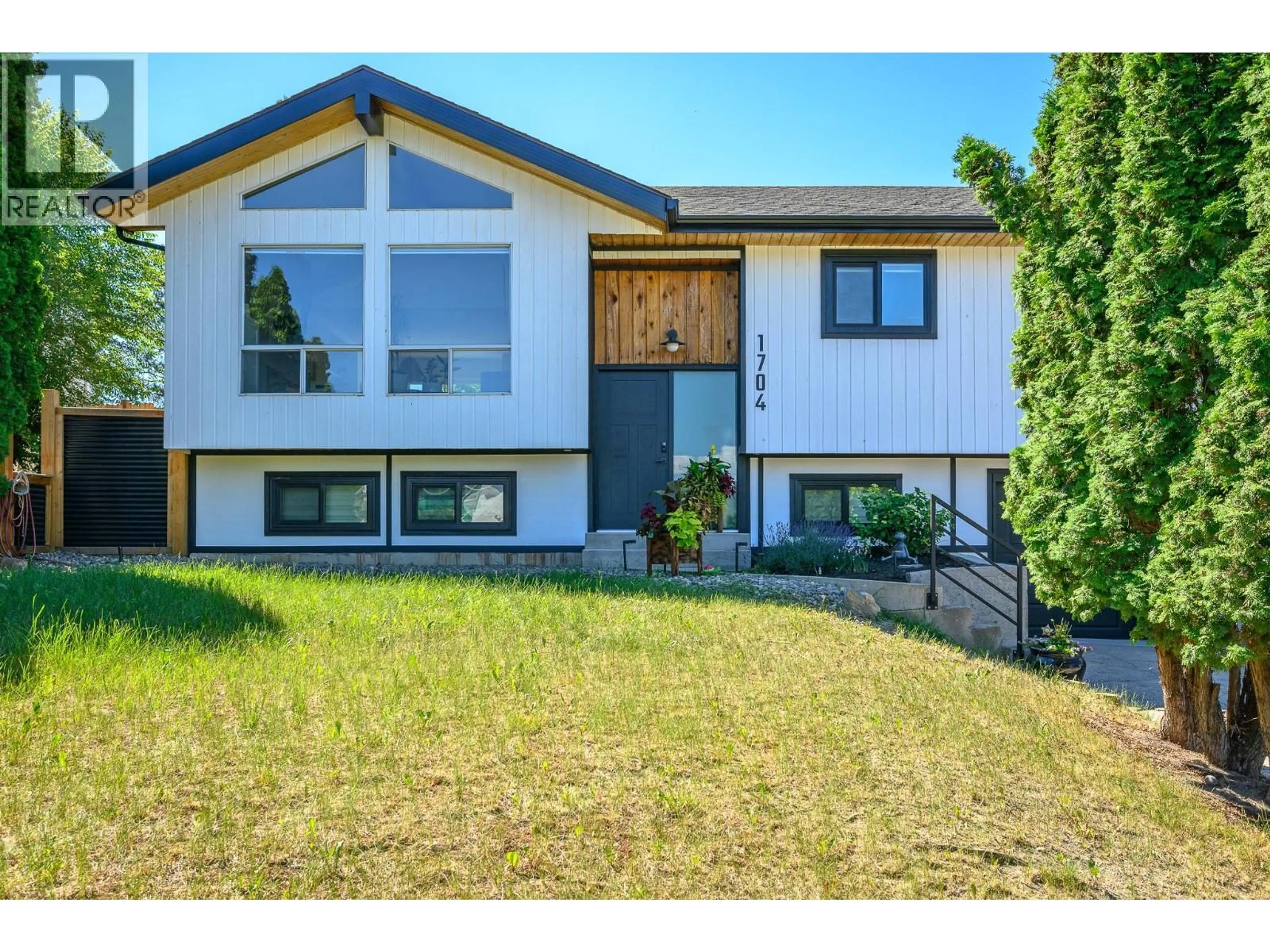 Home with vinyl exterior material, street for 1704 POTTERY ROAD, Vernon British Columbia V1T8M1