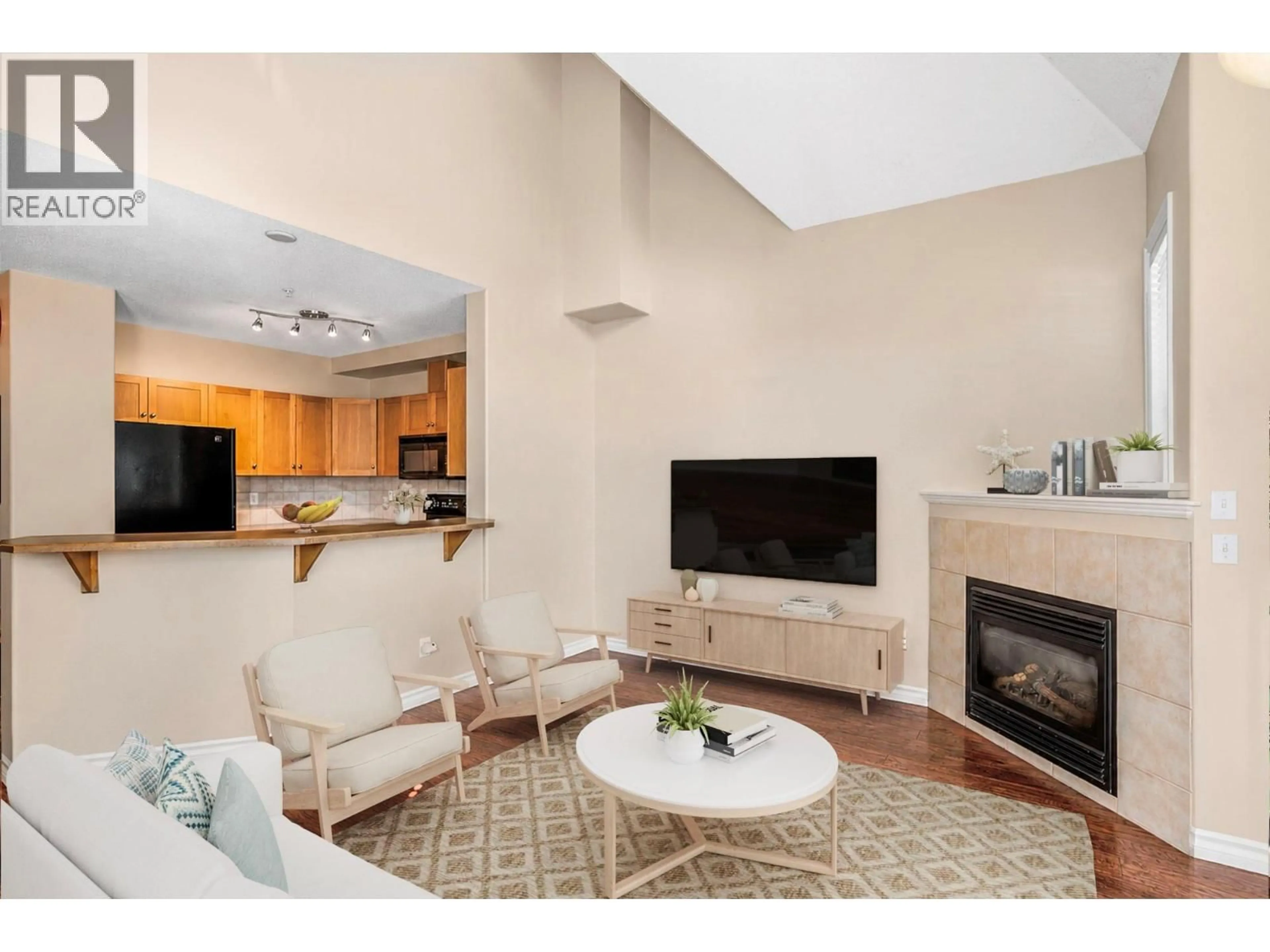 Living room with furniture, unknown for 102 - 1128 SUNSET DRIVE, Kelowna British Columbia V1Y9W1
