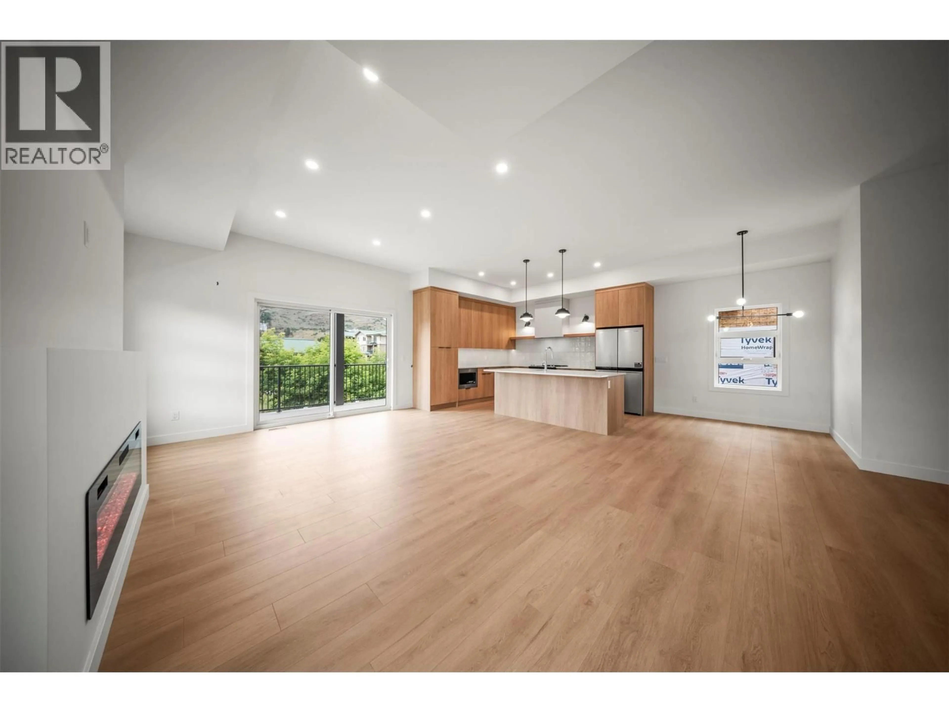 Open concept kitchen, wood/laminate floor for 2 - 4200 30 STREET, Vernon British Columbia V1T5E5