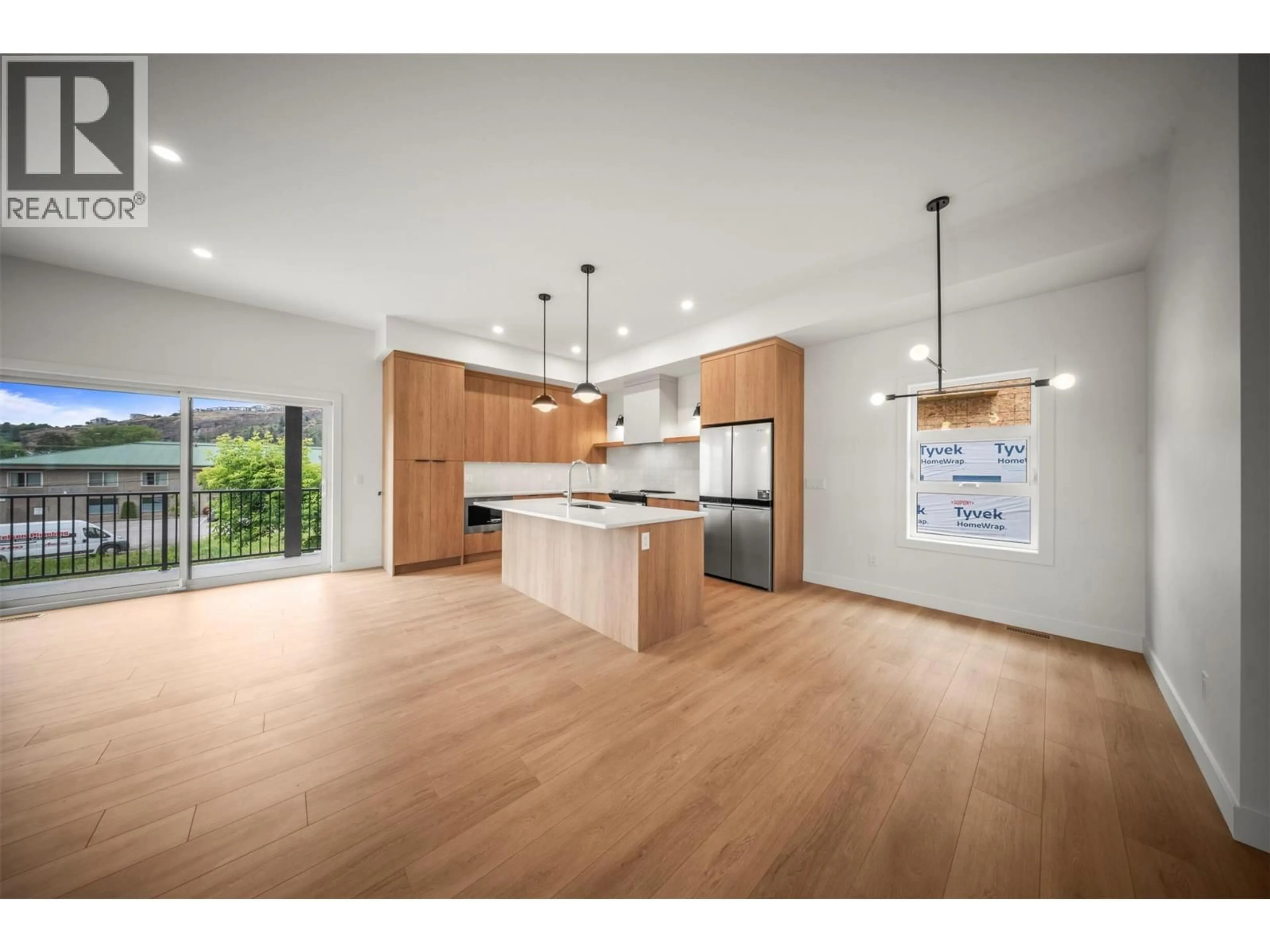 Open concept kitchen, wood/laminate floor for 2 - 4200 30 STREET, Vernon British Columbia V1T5E5