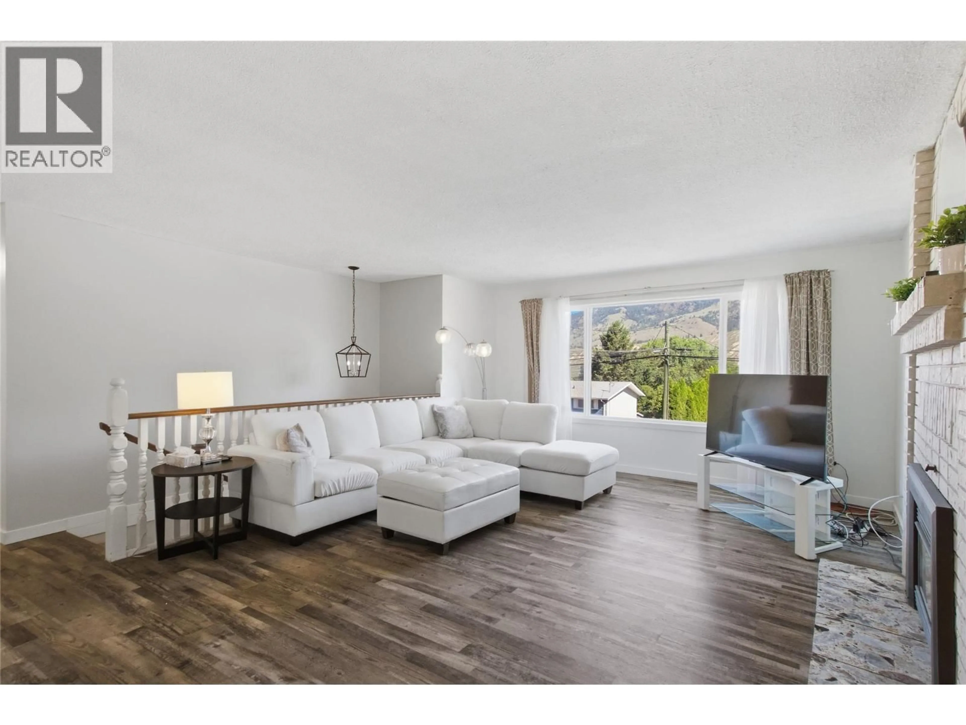 Living room with furniture, wood/laminate floor for 6193 DALLAS DRIVE, Kamloops British Columbia V2C5Z9
