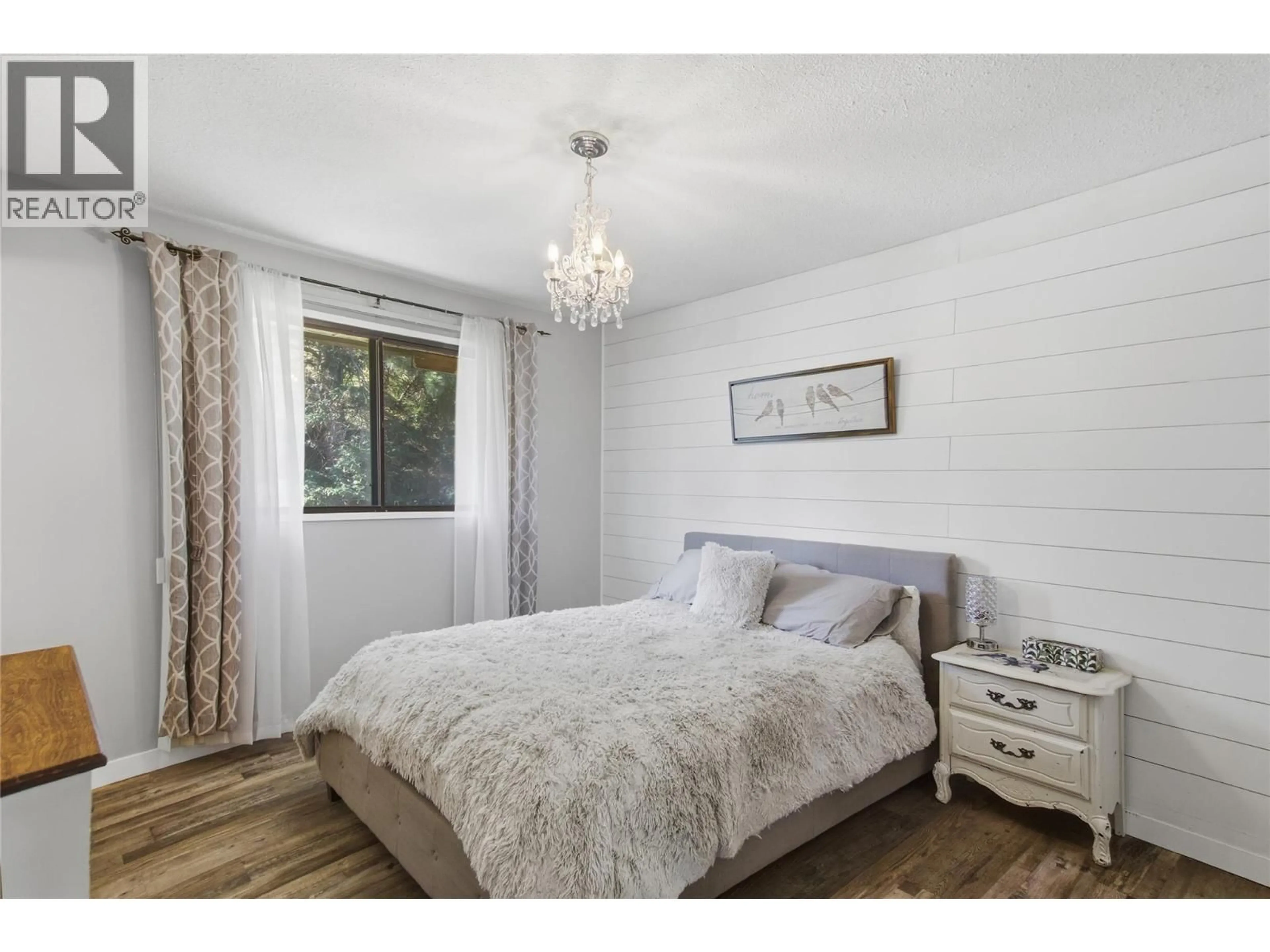 Bedroom with bed, wood/laminate floor for 6193 DALLAS DRIVE, Kamloops British Columbia V2C5Z9
