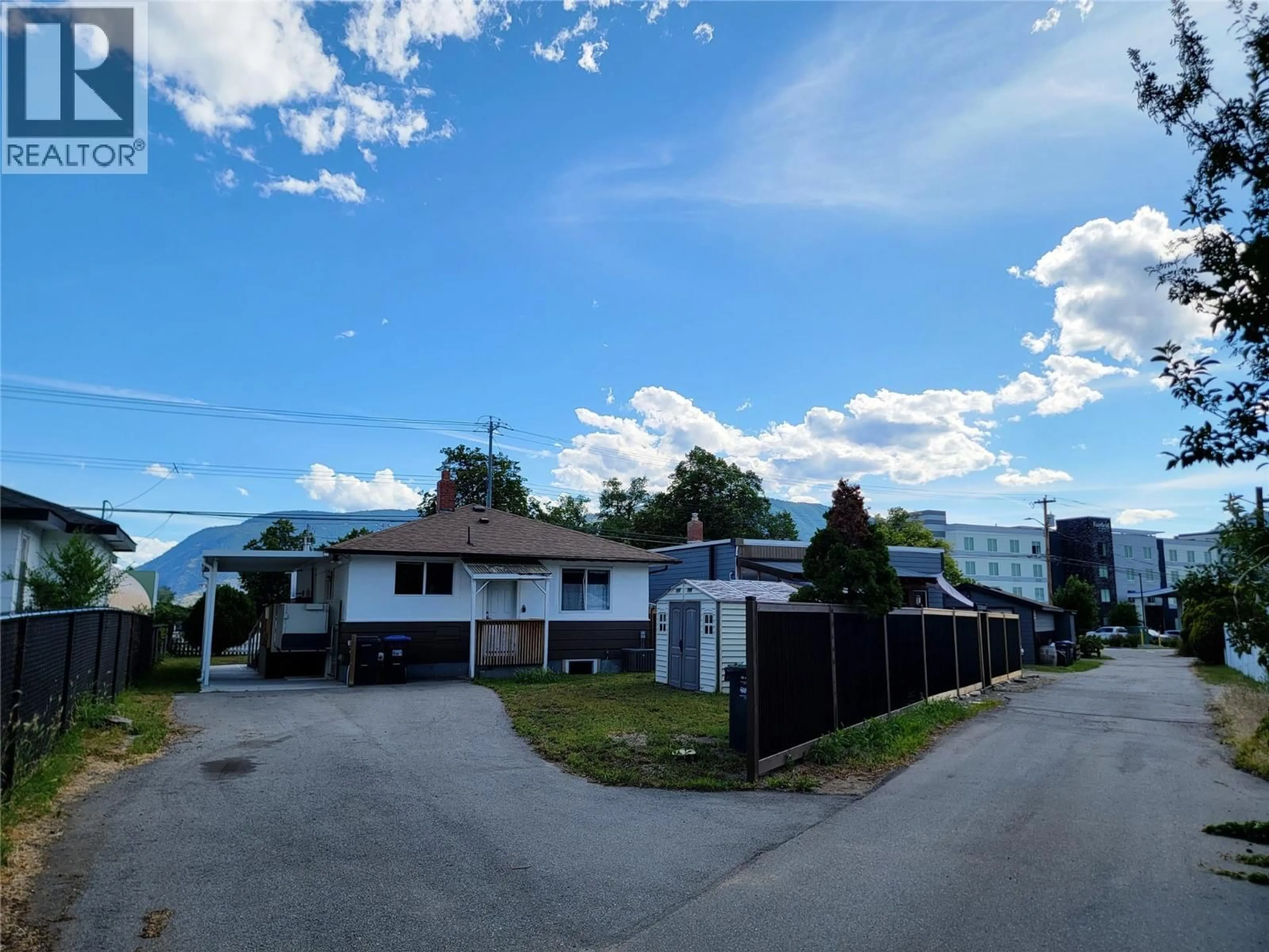 A pic from outside/outdoor area/front of a property/back of a property/a pic from drone, street for 565 ECKHARDT AVENUE WEST, Penticton British Columbia V2A2A5