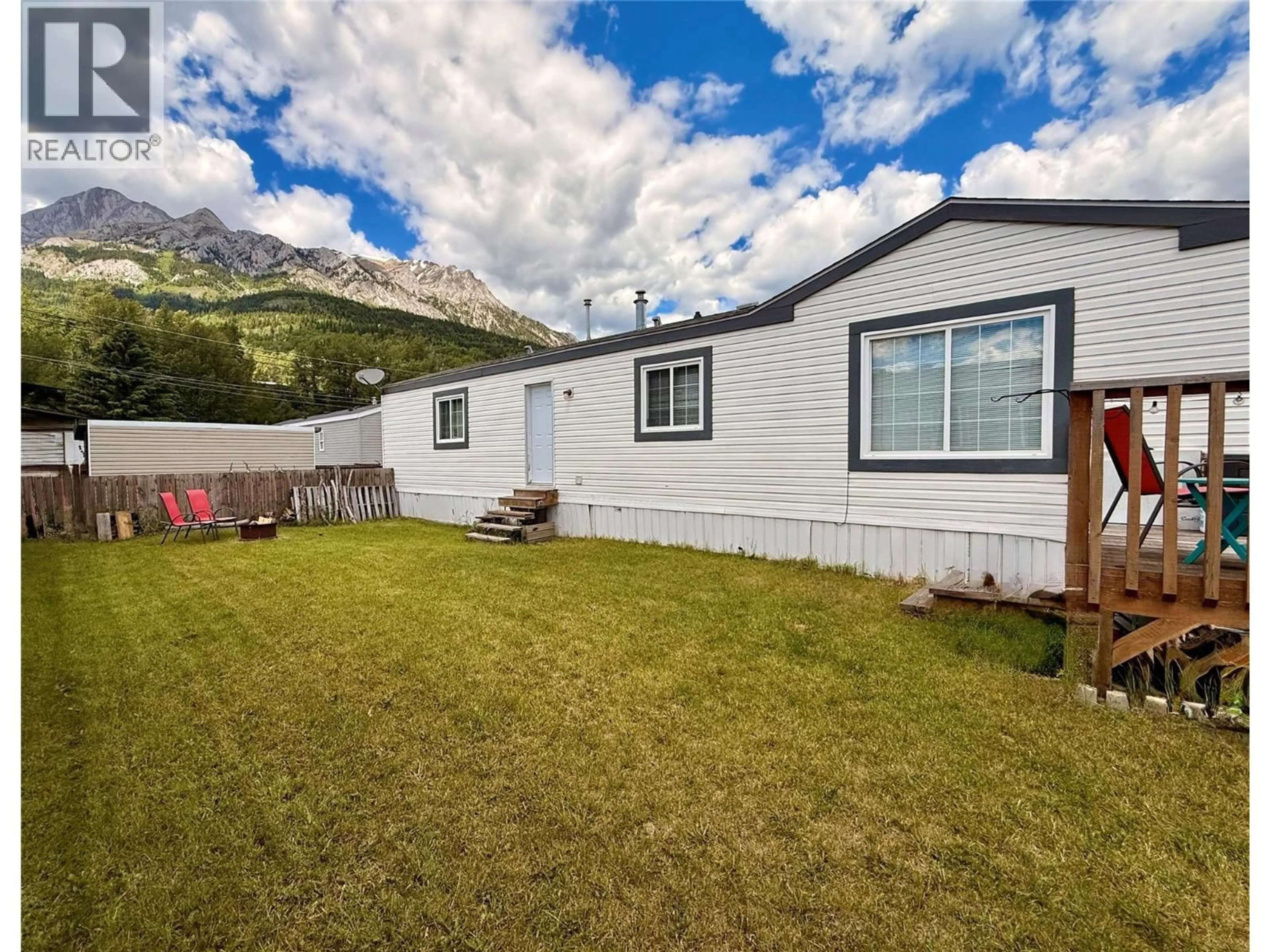 A pic from outside/outdoor area/front of a property/back of a property/a pic from drone, mountain view for 31 - 2011 3 HIGHWAY, Fernie British Columbia V0B1M5