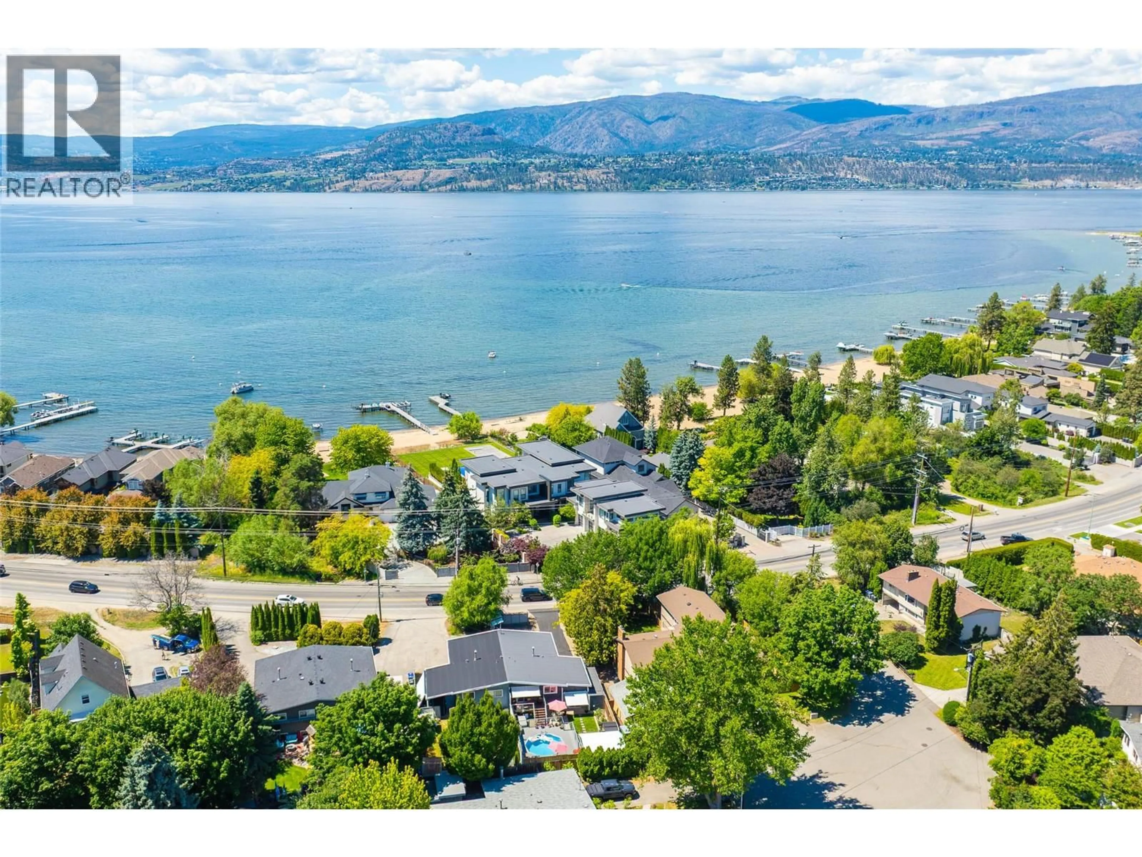 A pic from outside/outdoor area/front of a property/back of a property/a pic from drone, water/lake/river/ocean view for 4171 LAKESHORE ROAD, Kelowna British Columbia V1W1W1