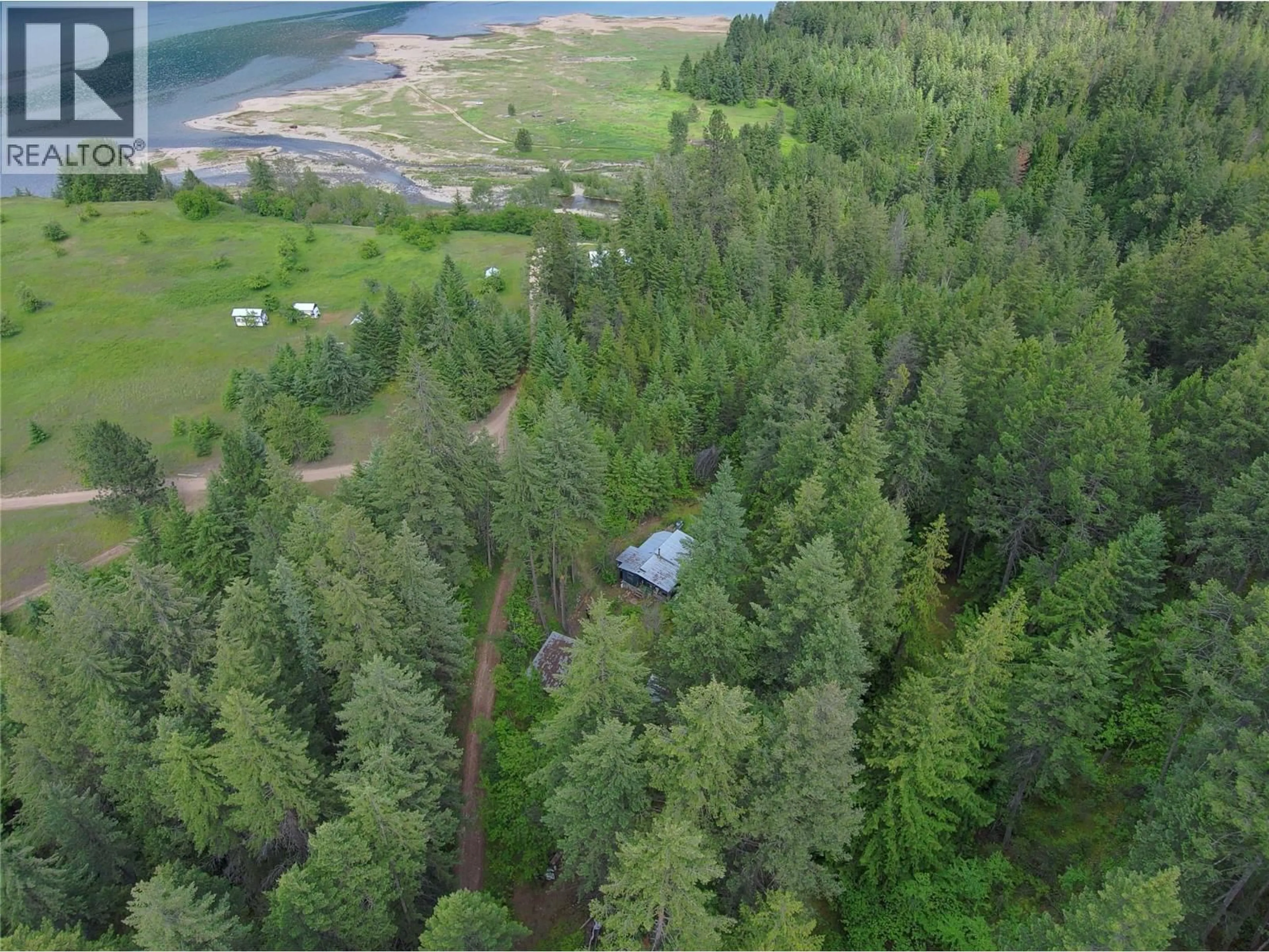A pic from outside/outdoor area/front of a property/back of a property/a pic from drone, water/lake/river/ocean view for 648 LOWER ARROW LAKE ROAD, Renata British Columbia V1N4V8