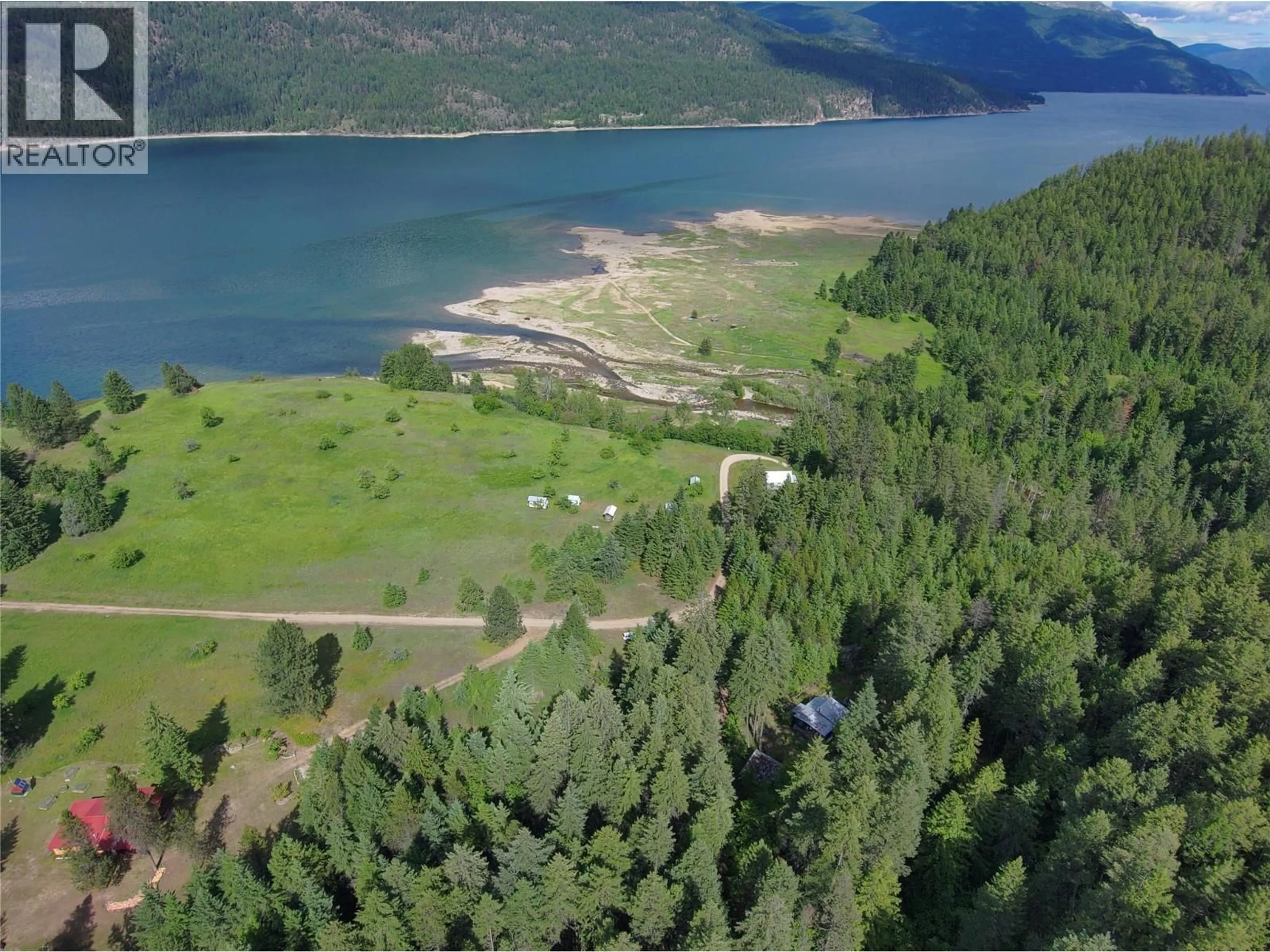 A pic from outside/outdoor area/front of a property/back of a property/a pic from drone, water/lake/river/ocean view for 648 LOWER ARROW LAKE ROAD, Renata British Columbia V1N4V8