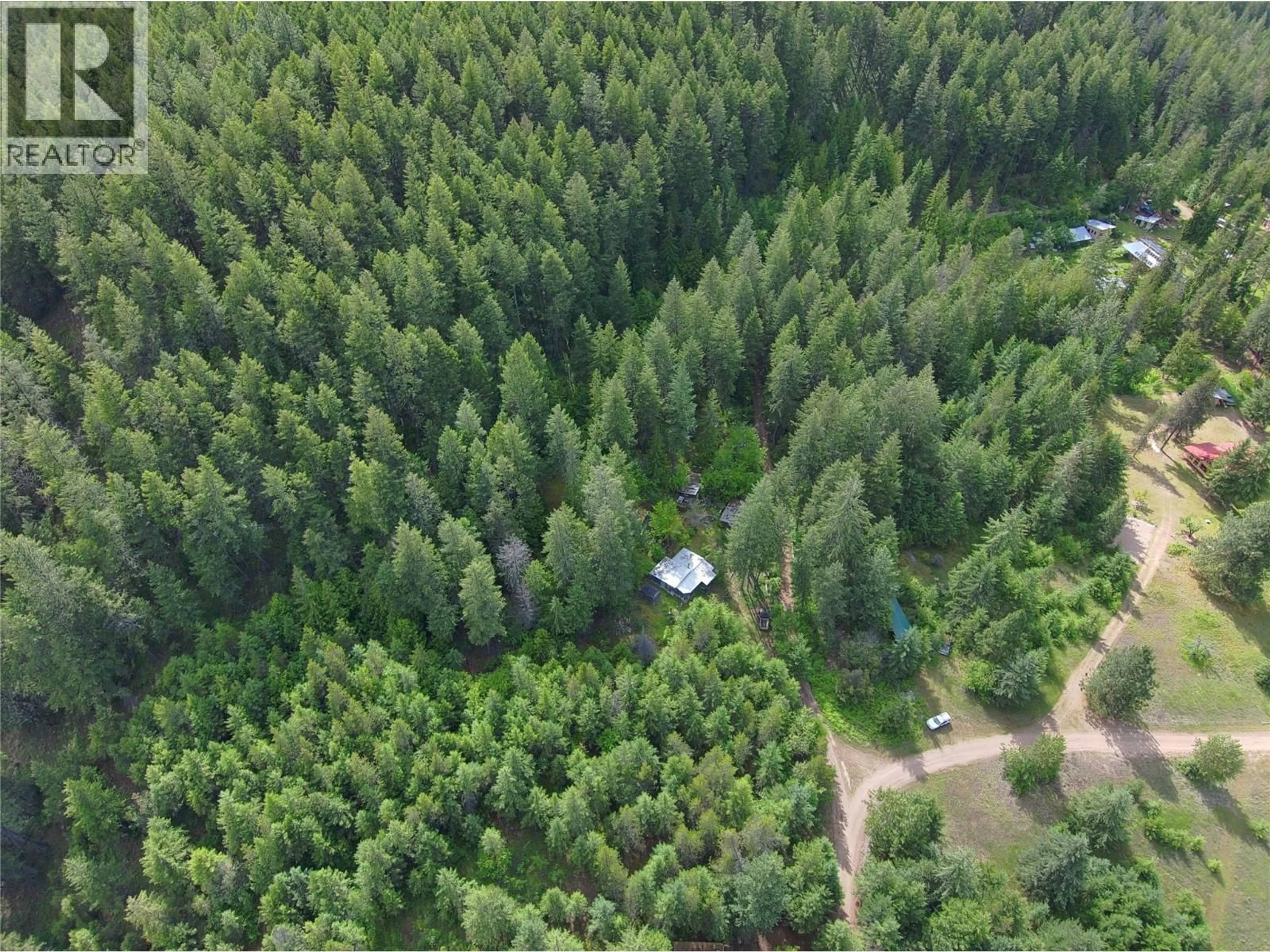 A pic from outside/outdoor area/front of a property/back of a property/a pic from drone, forest/trees view for 648 LOWER ARROW LAKE ROAD, Renata British Columbia V1N4V8