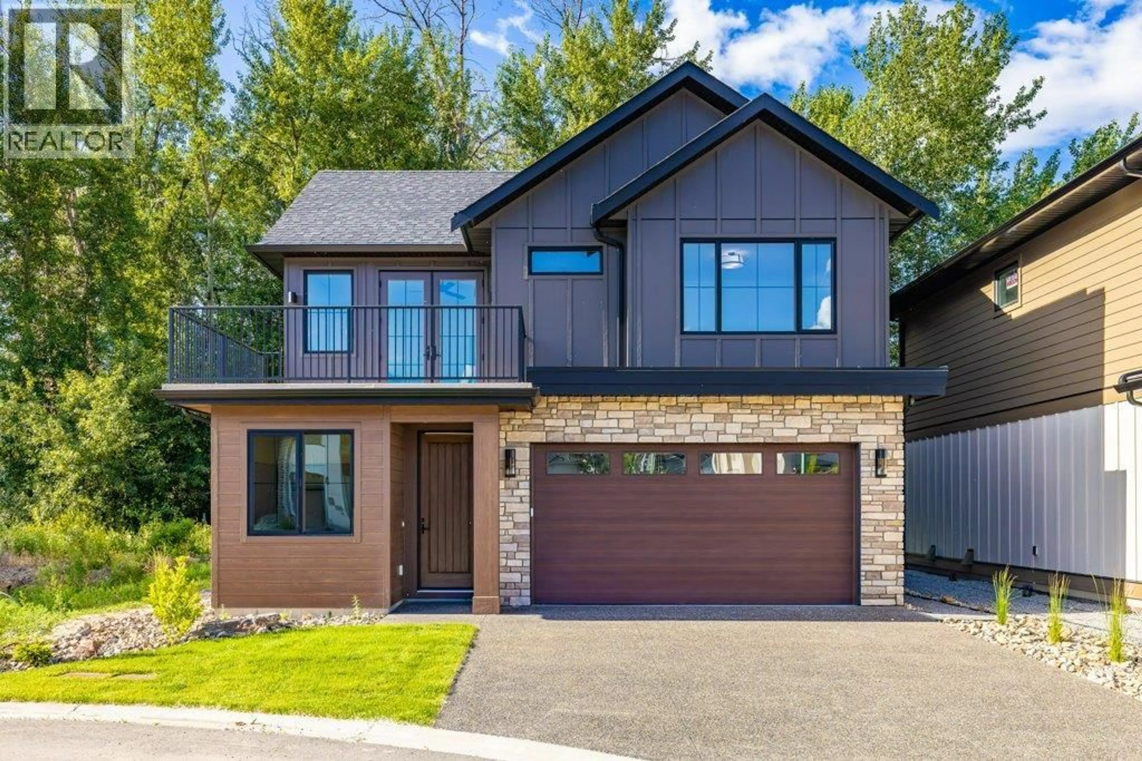 Home with brick exterior material, street for 906 BULL CRESCENT, Kelowna British Columbia V1W0E6