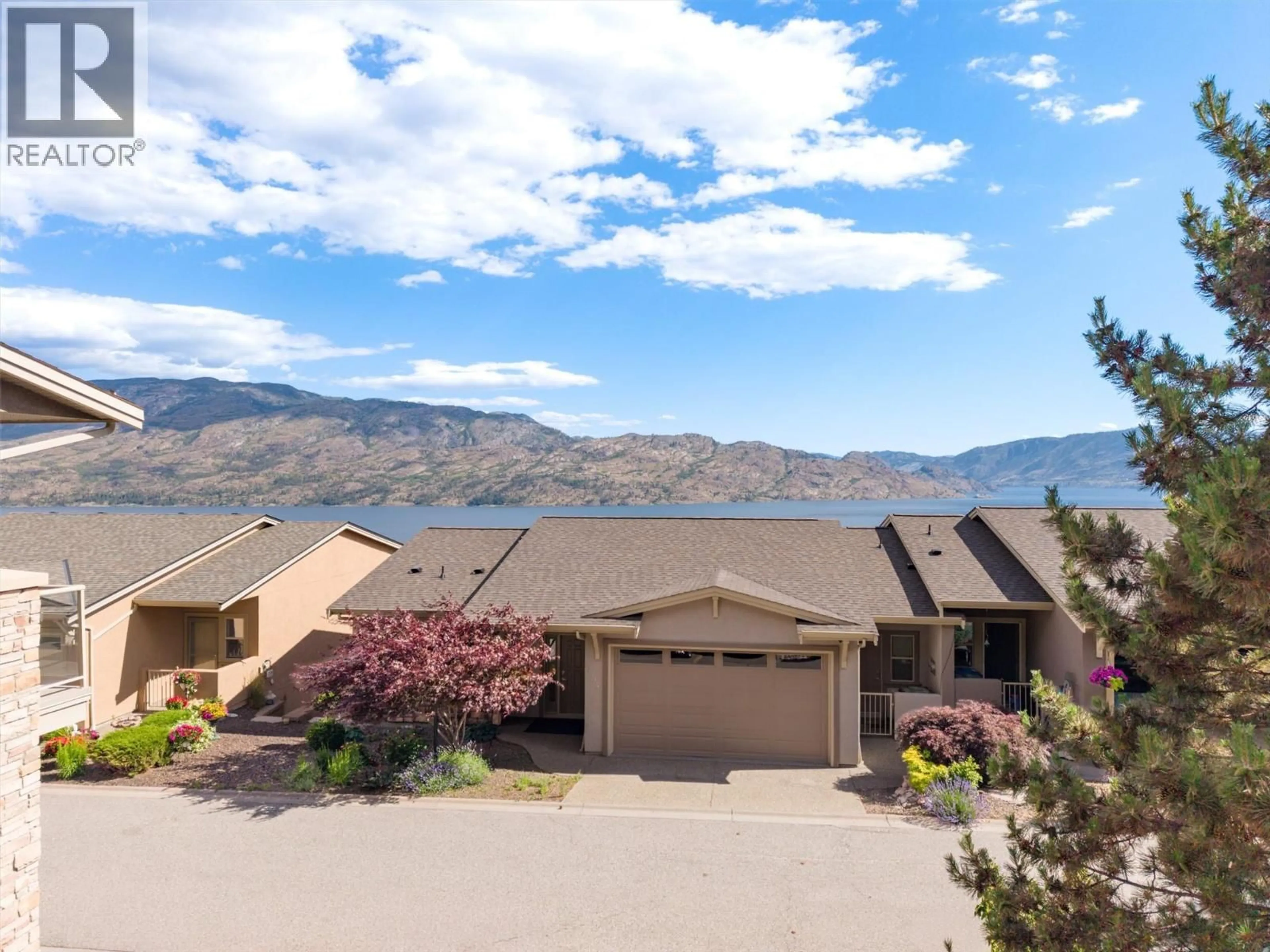 A pic from outside/outdoor area/front of a property/back of a property/a pic from drone, mountain view for 254 - 5165 TREPANIER BENCH ROAD, Peachland British Columbia V0H1X2