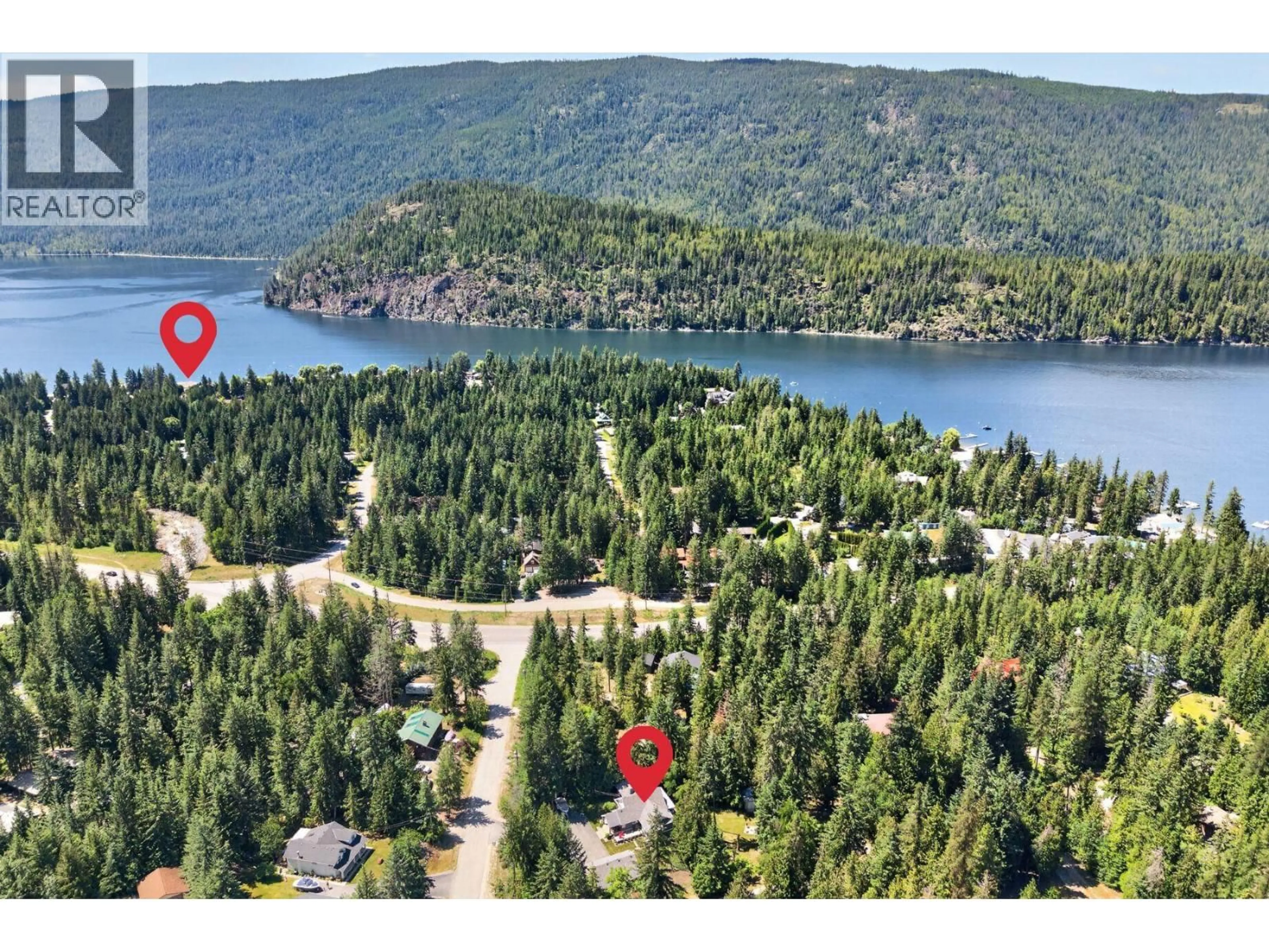 A pic from outside/outdoor area/front of a property/back of a property/a pic from drone, water/lake/river/ocean view for 587 HUNT ROAD, Swansea Point British Columbia V0E2K2