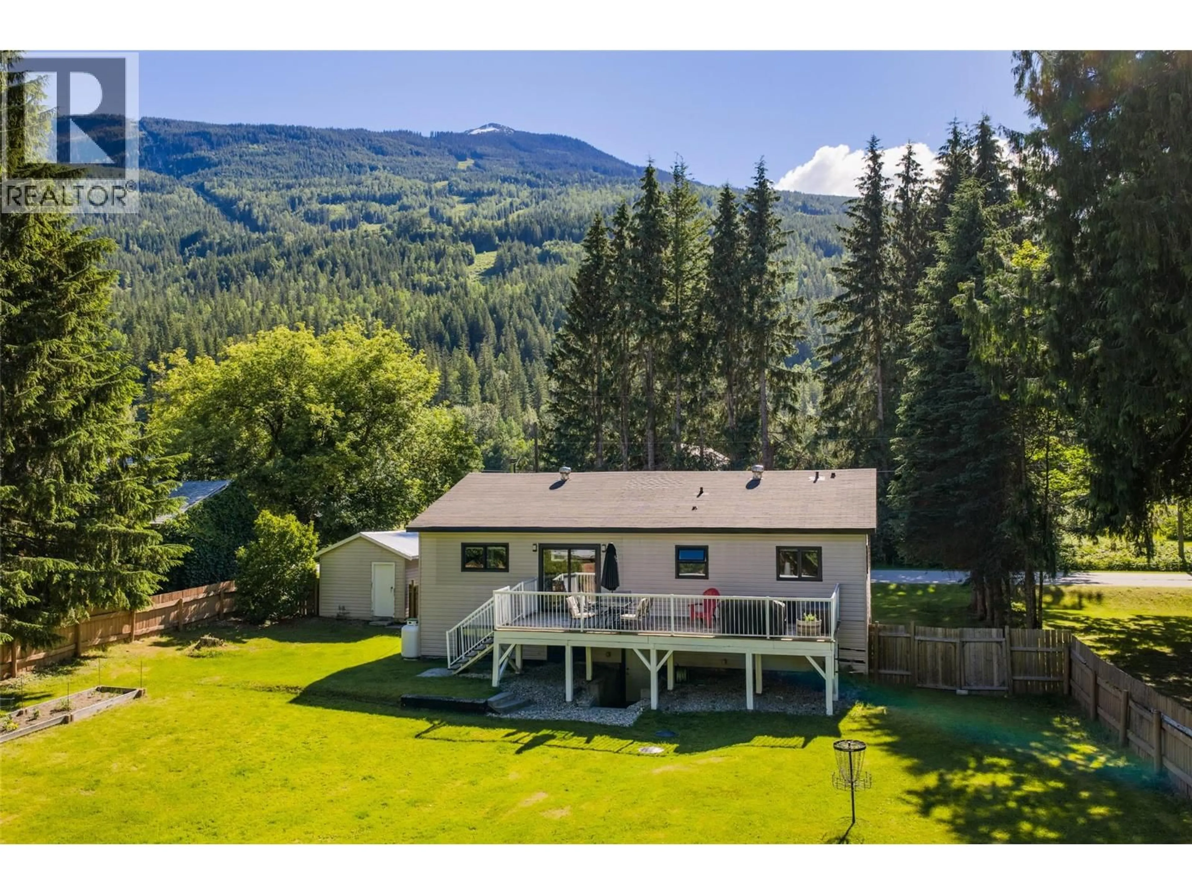 A pic from outside/outdoor area/front of a property/back of a property/a pic from drone, water/lake/river/ocean view for 3447 CATHERWOOD ROAD, Revelstoke British Columbia V0E2S3