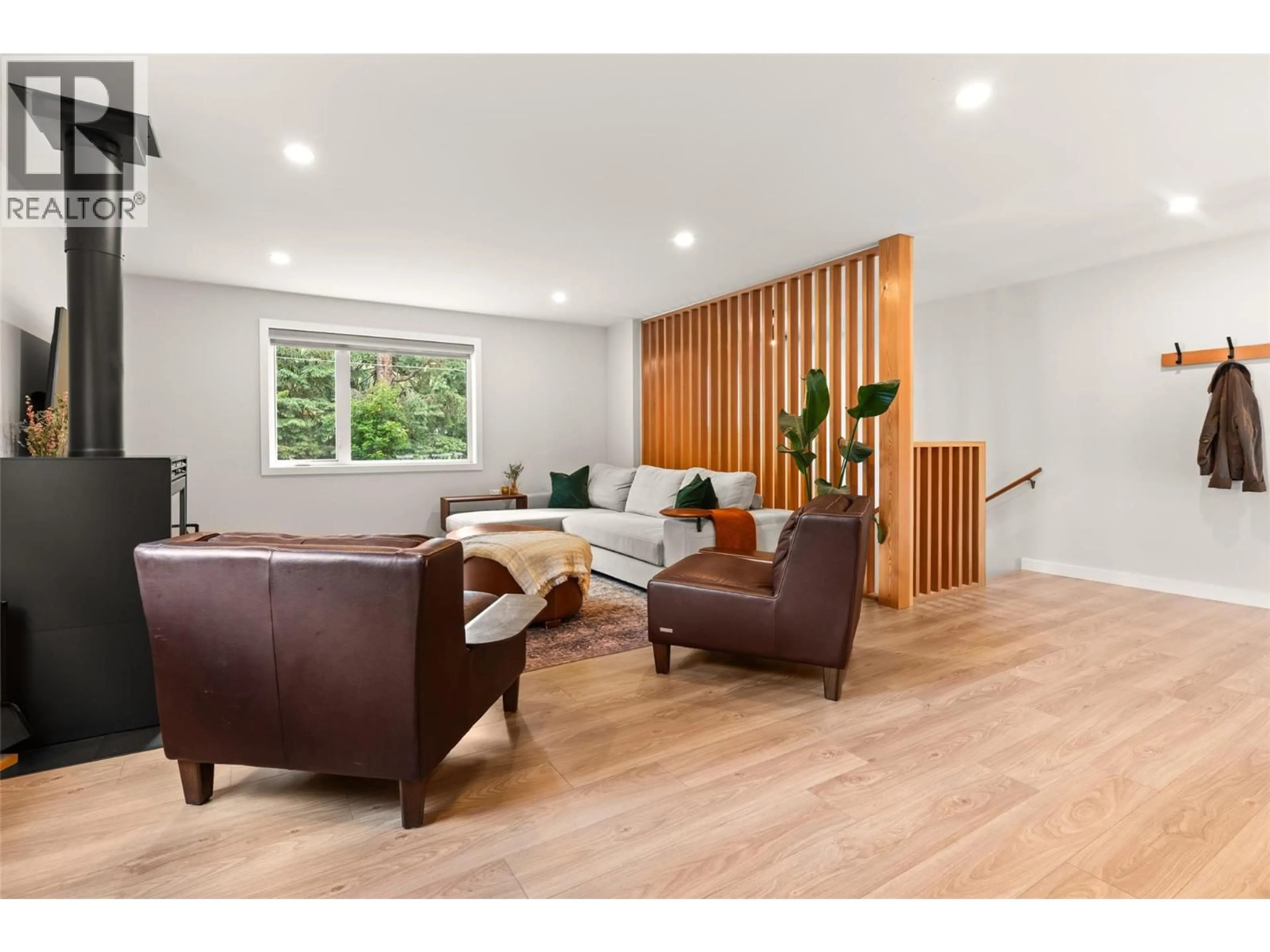 Living room with furniture, wood/laminate floor for 3447 CATHERWOOD ROAD, Revelstoke British Columbia V0E2S3
