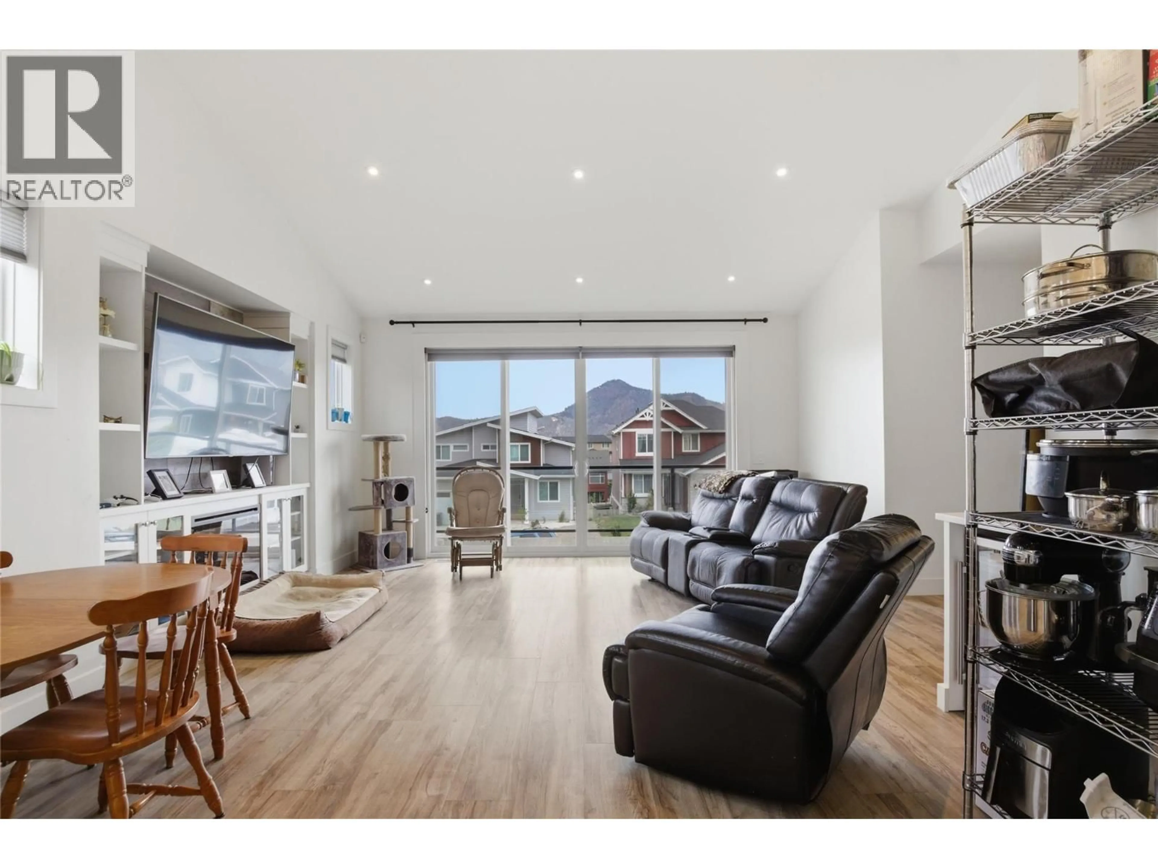 Living room with furniture, wood/laminate floor for 1568 EMERALD DRIVE, Kamloops British Columbia V2E0C4