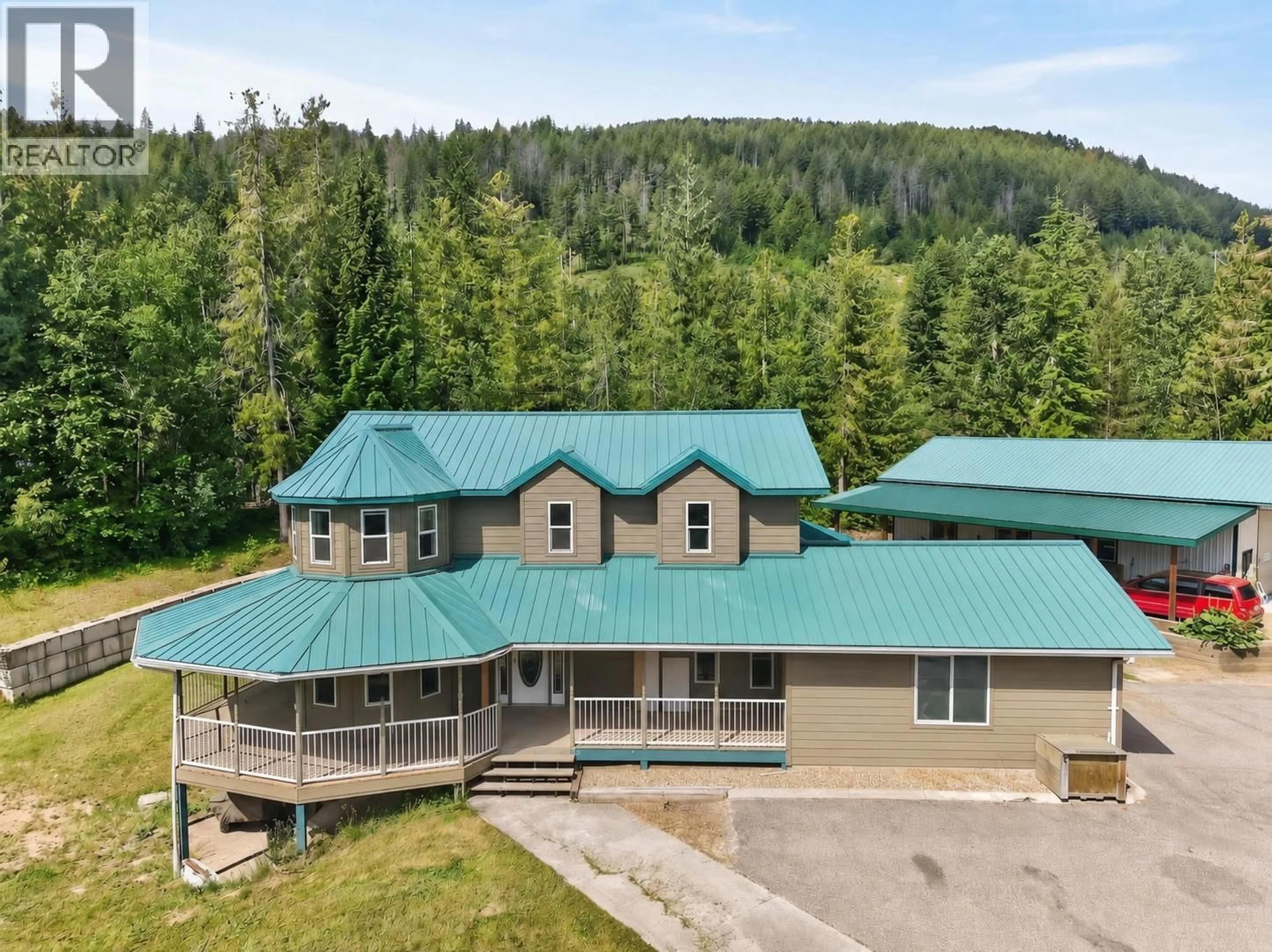 A pic from outside/outdoor area/front of a property/back of a property/a pic from drone, mountain view for 5364 SHAW ROAD, Salmon Arm British Columbia V1E2W2