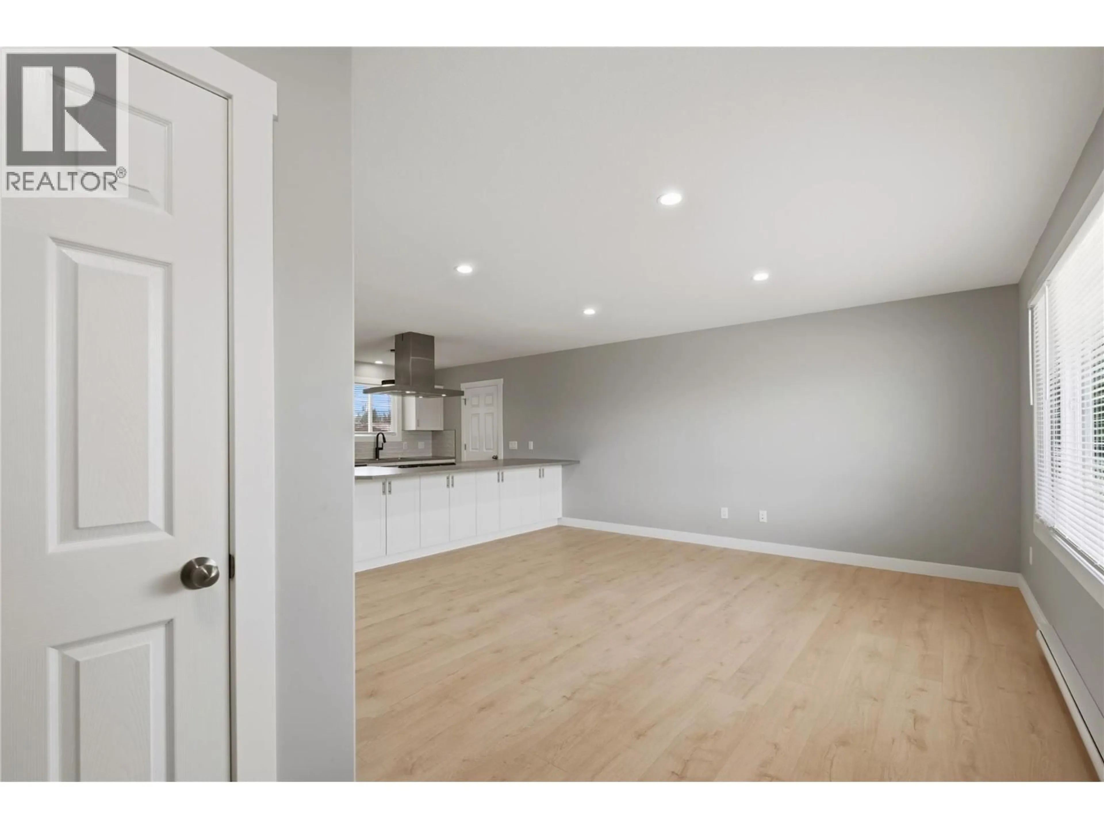 Open concept kitchen, wood/laminate floor for 365 SUMAC ROAD WEST, Kelowna British Columbia V1X4K2