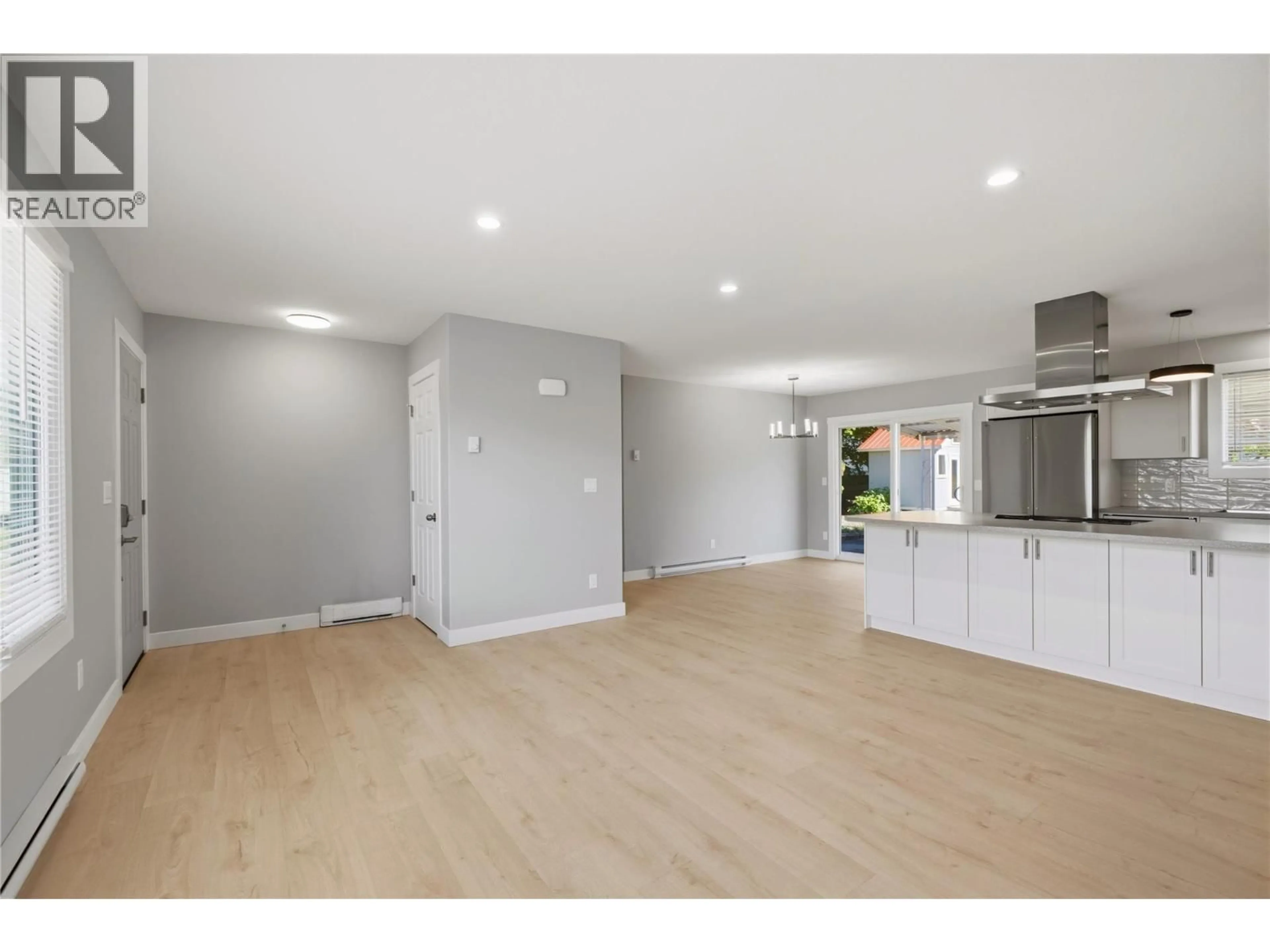 Open concept kitchen, wood/laminate floor for 365 SUMAC ROAD WEST, Kelowna British Columbia V1X4K2