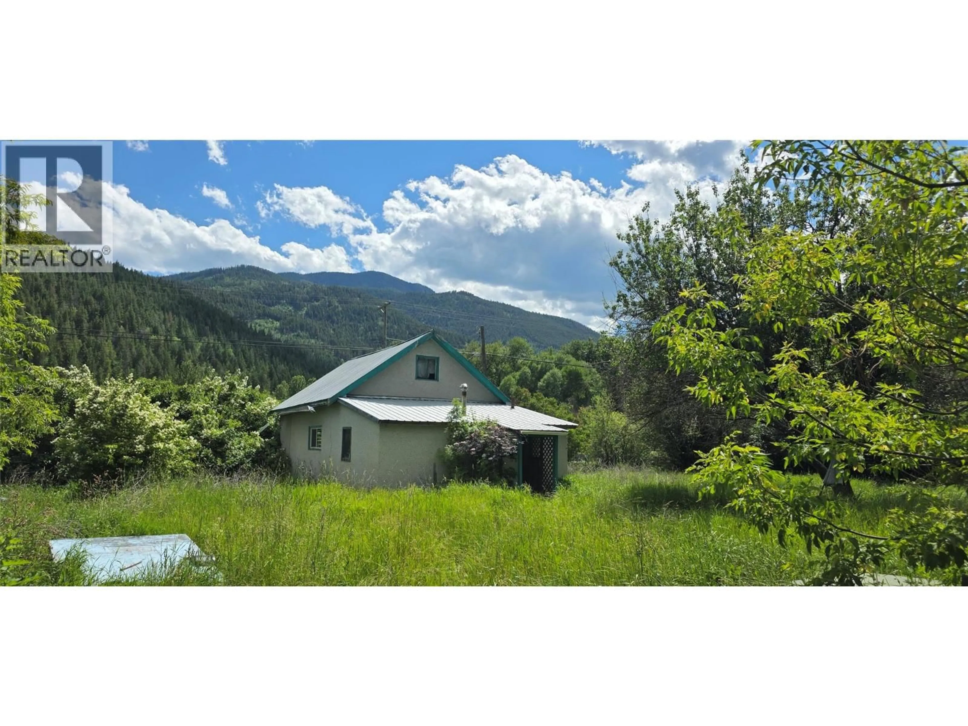 A pic from outside/outdoor area/front of a property/back of a property/a pic from drone, mountain view for 5778 HIGHWAY 97 OTHER, Falkland British Columbia V0E1W0