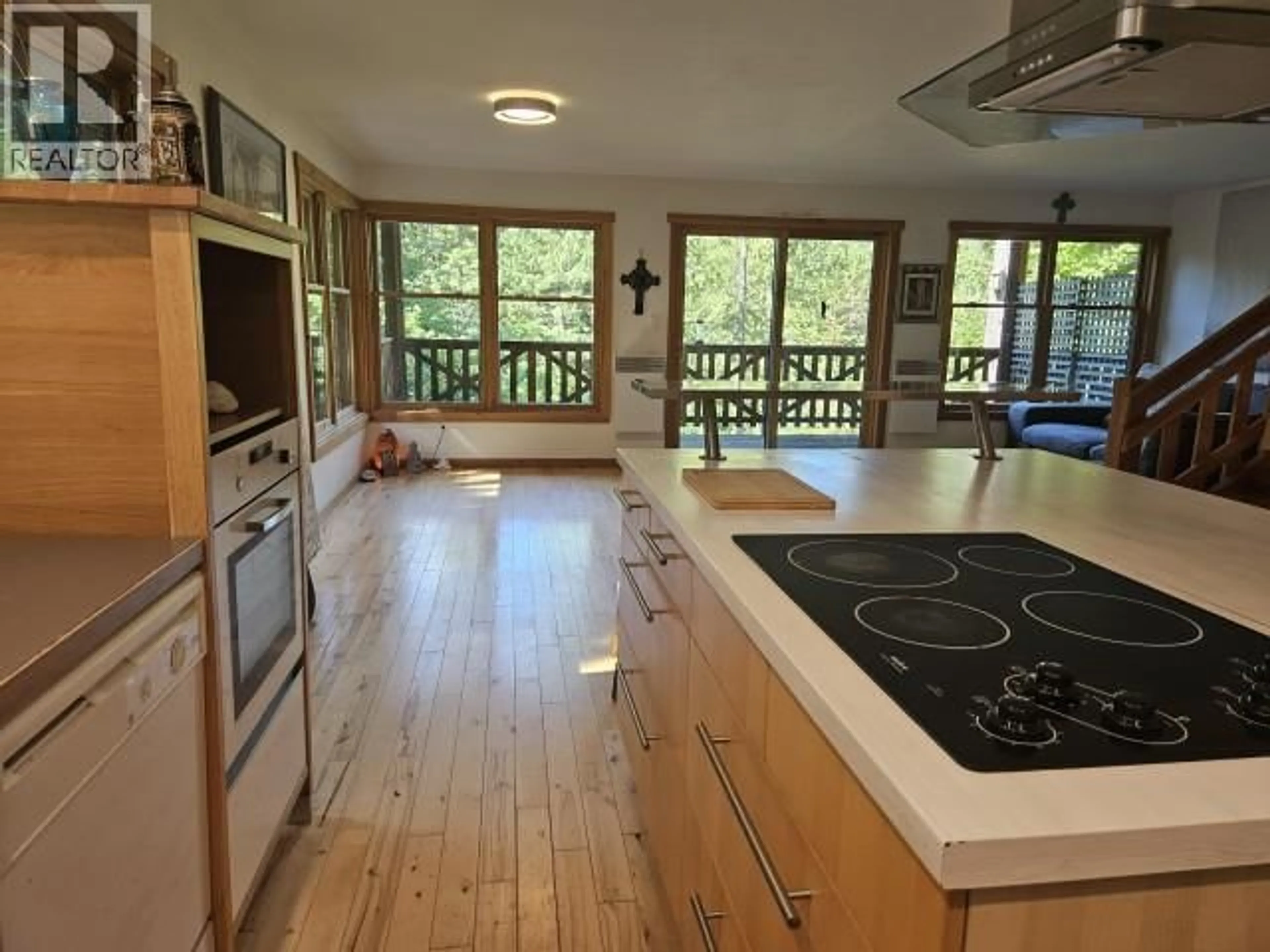 Open concept kitchen, wood/laminate floor for 218 CLARK ROAD, Burton British Columbia V0G1E0