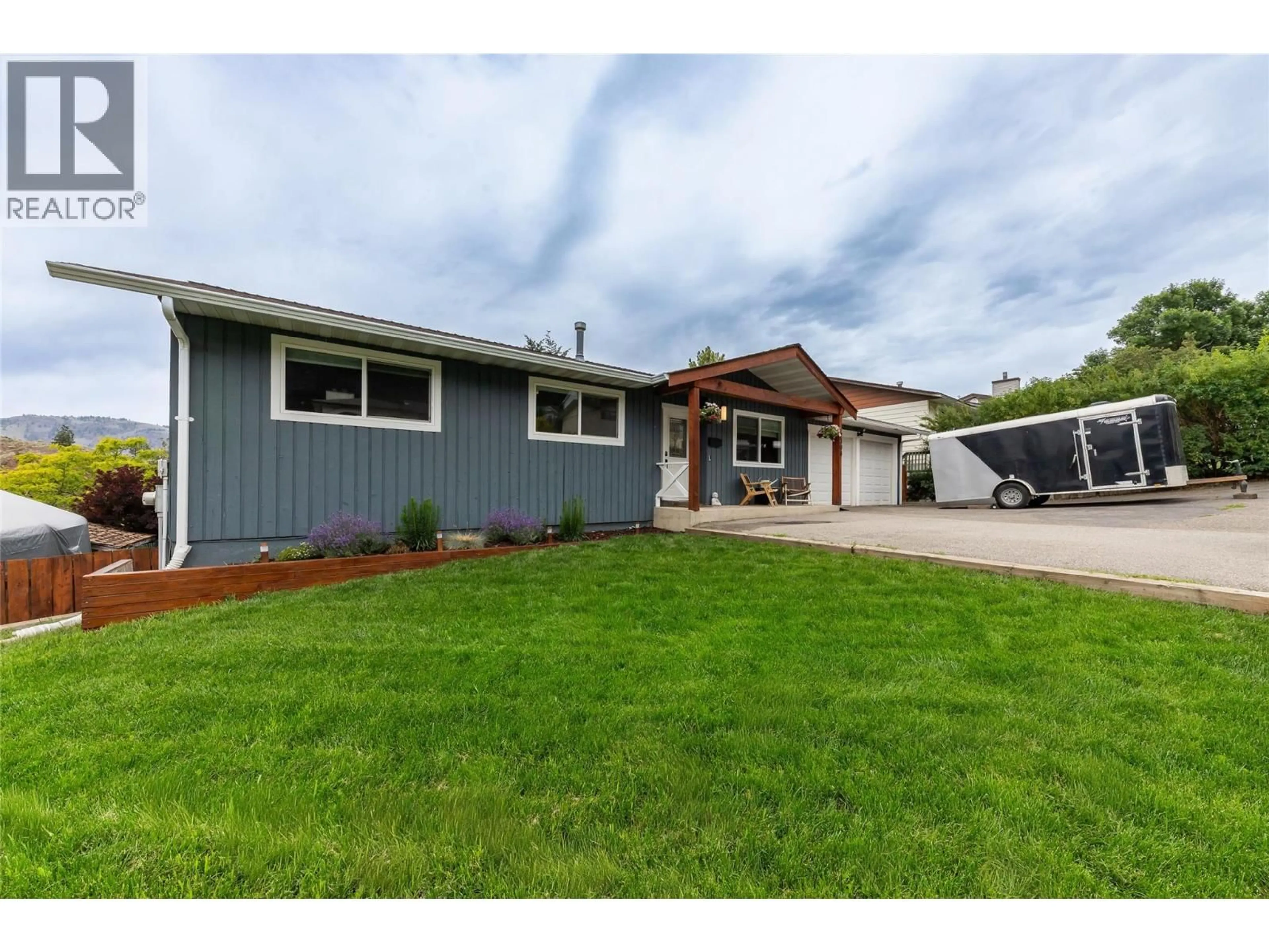 Home with vinyl exterior material, street for 2308 OMINECA DRIVE, Kamloops British Columbia V2E1X3