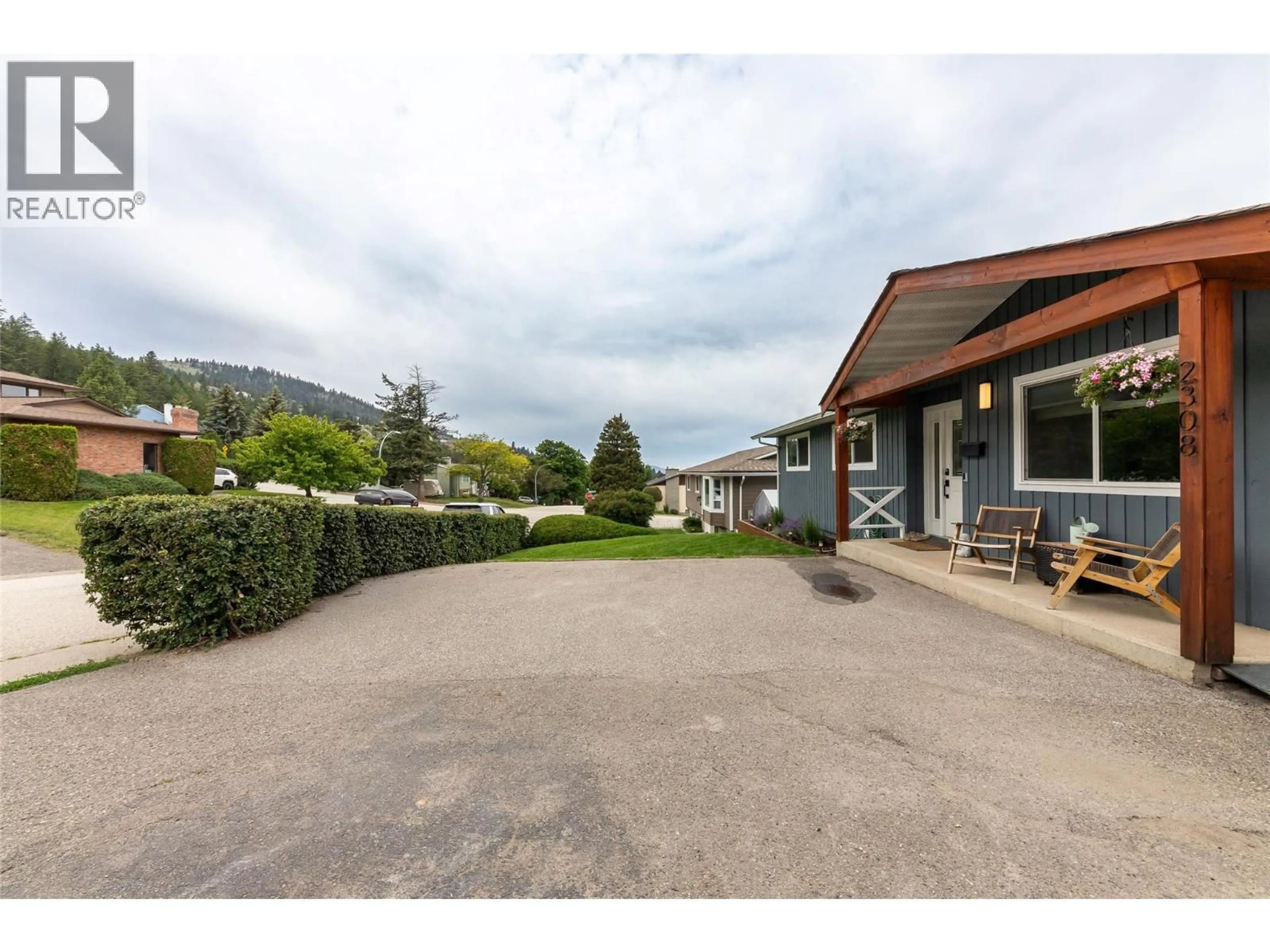 A pic from outside/outdoor area/front of a property/back of a property/a pic from drone, mountain view for 2308 OMINECA DRIVE, Kamloops British Columbia V2E1X3