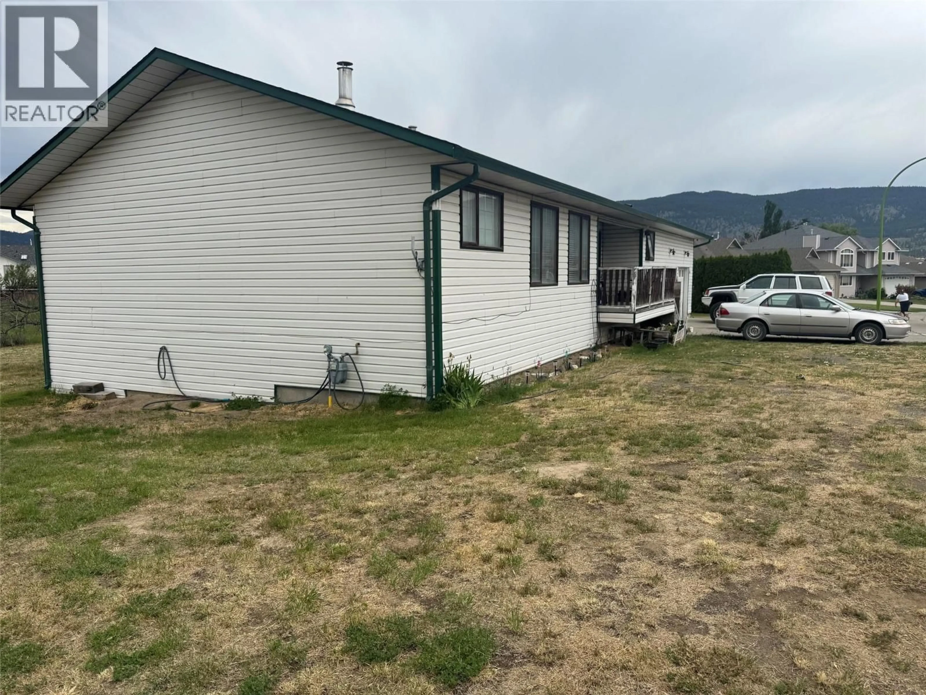 A pic from outside/outdoor area/front of a property/back of a property/a pic from drone, mountain view for 1501 BANN STREET, Merritt British Columbia V1K1P7