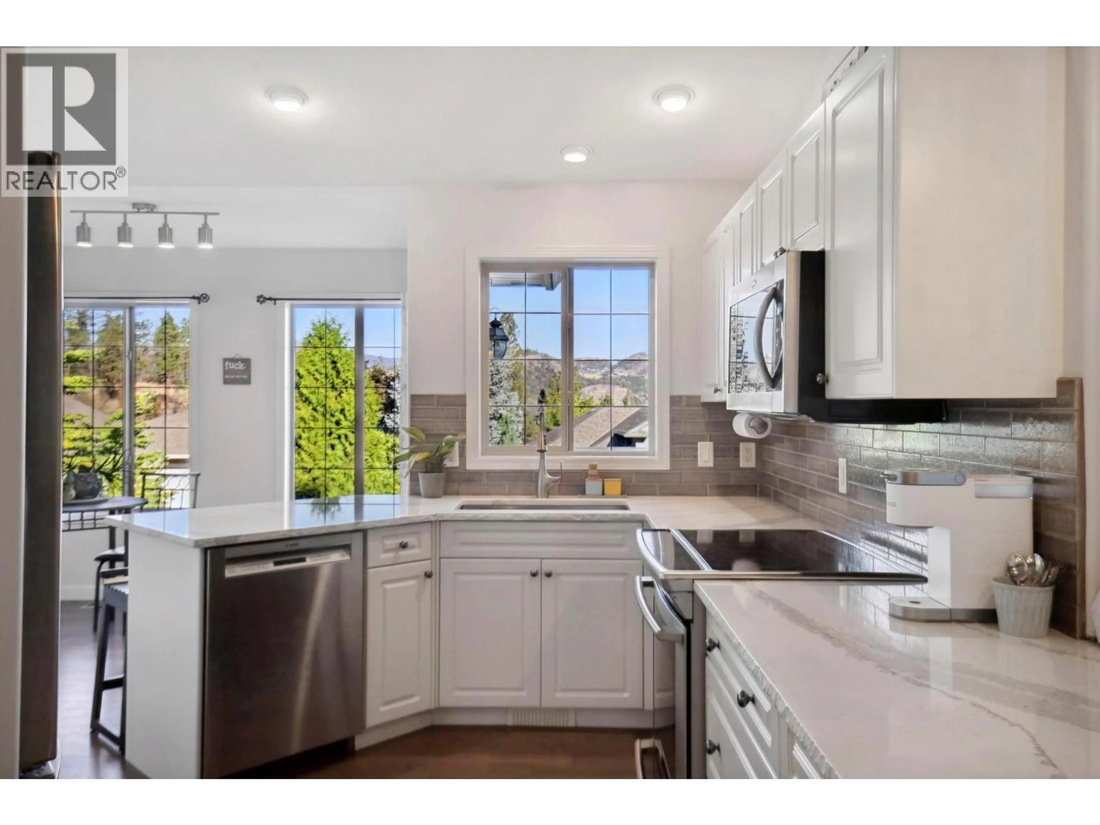 Open concept kitchen, ceramic/tile floor for 2089 BOWRON STREET, Kelowna British Columbia V1V2P2