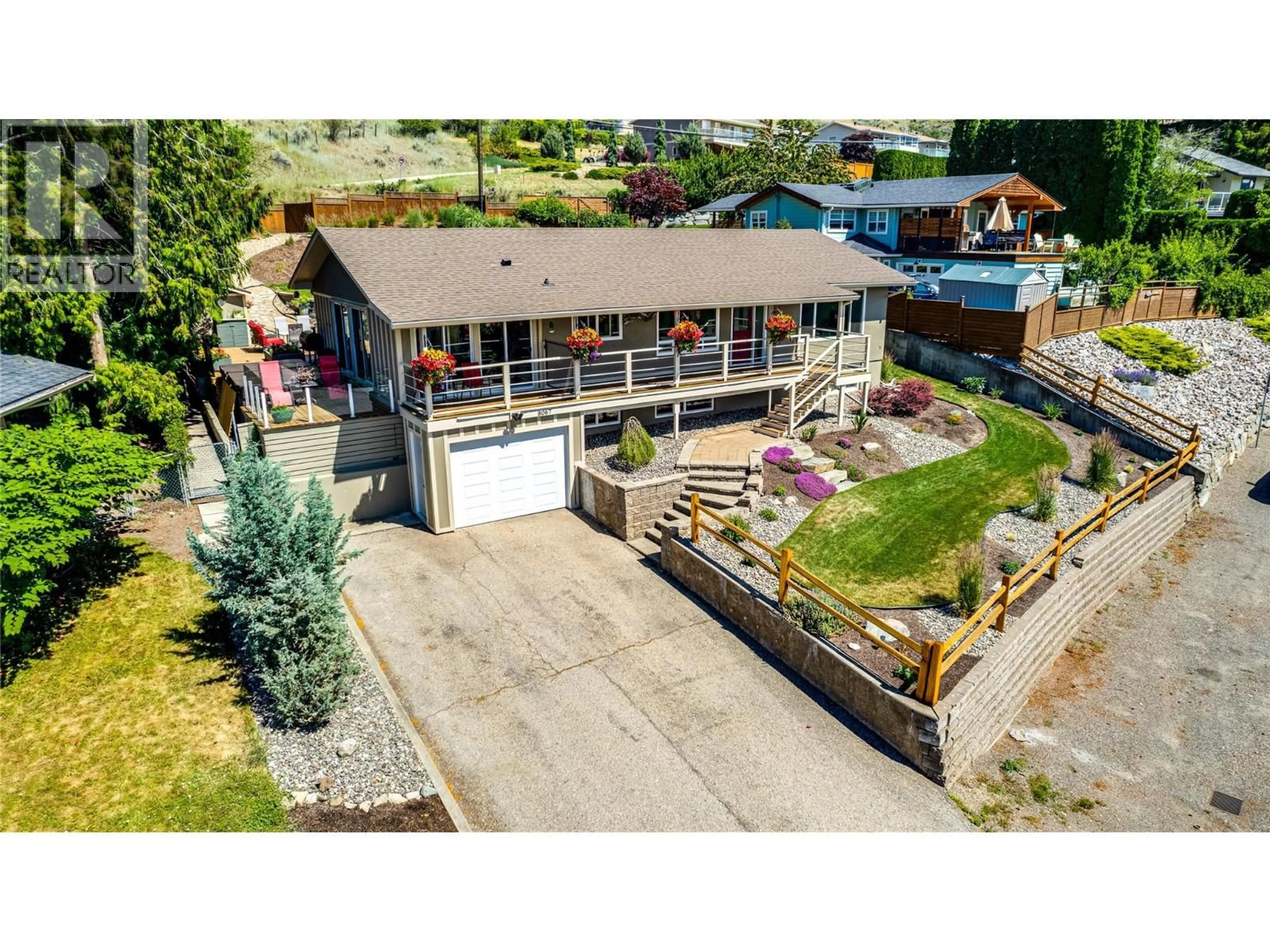 A pic from outside/outdoor area/front of a property/back of a property/a pic from drone, unknown for 8067 BEACHCOMBER BAY ROAD, Vernon British Columbia V1H1C7