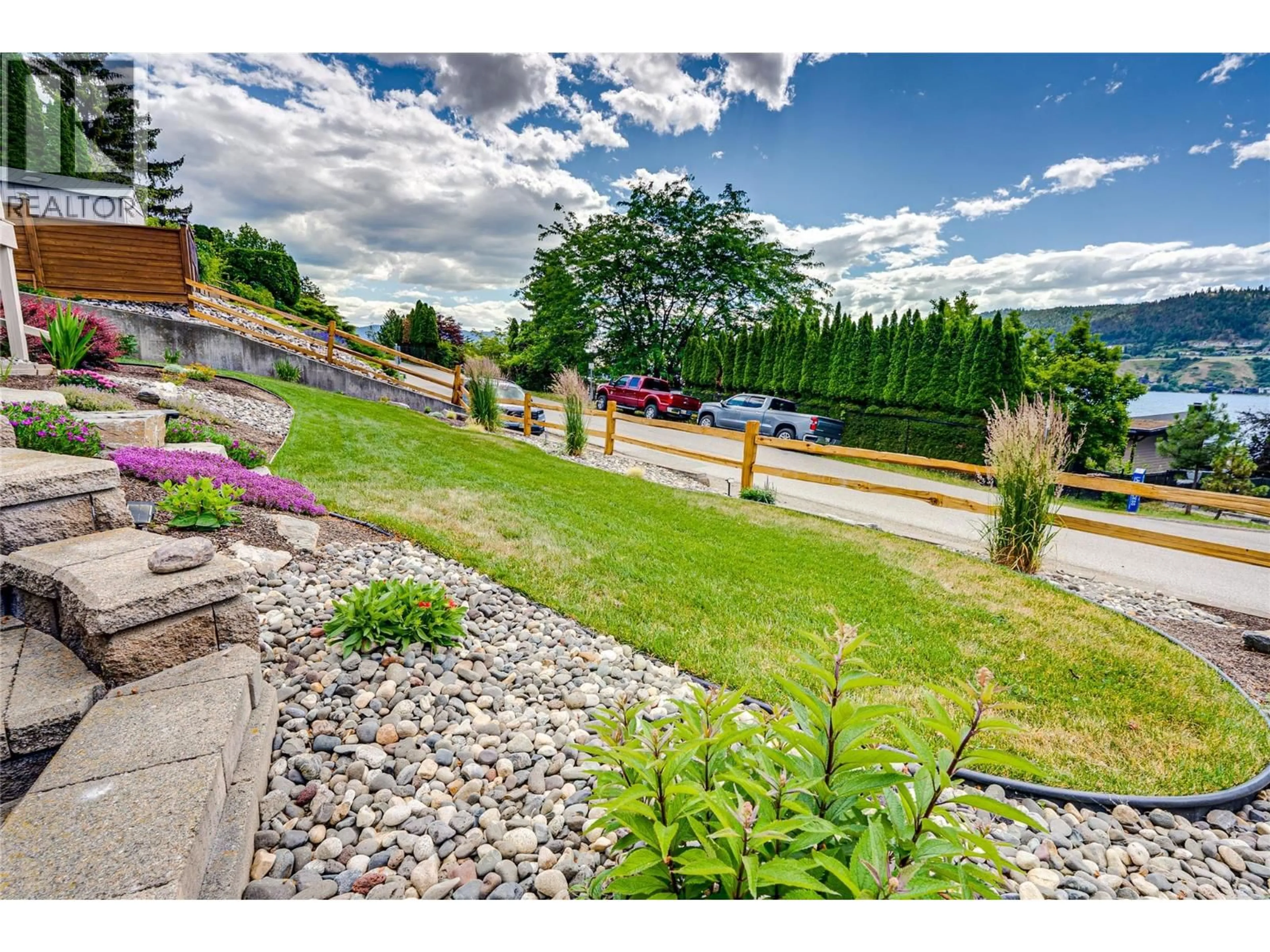 A pic from outside/outdoor area/front of a property/back of a property/a pic from drone, mountain view for 8067 BEACHCOMBER BAY ROAD, Vernon British Columbia V1H1C7