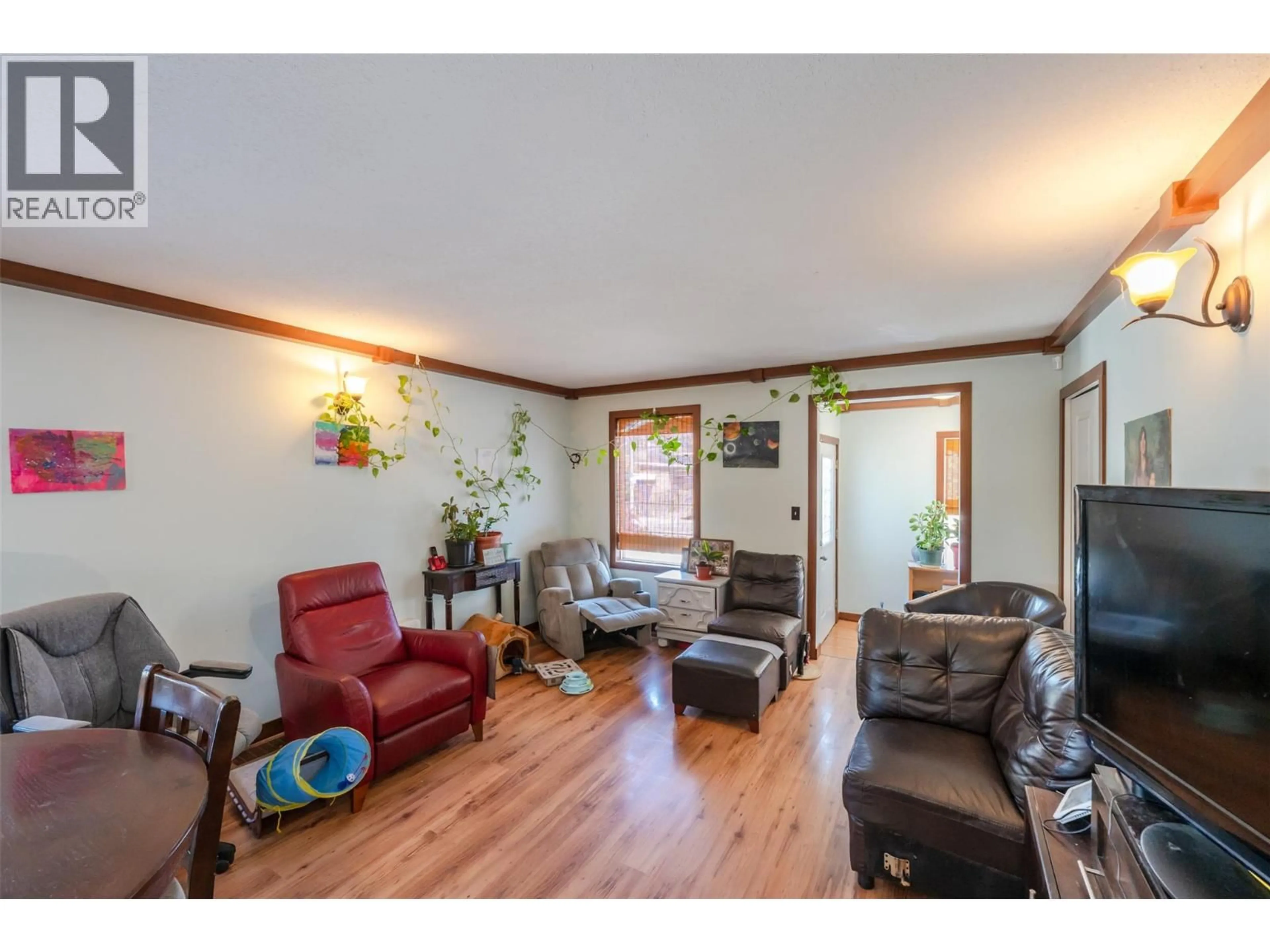 Living room with furniture, wood/laminate floor for 759 GOVERNMENT STREET, Penticton British Columbia V2A4T5