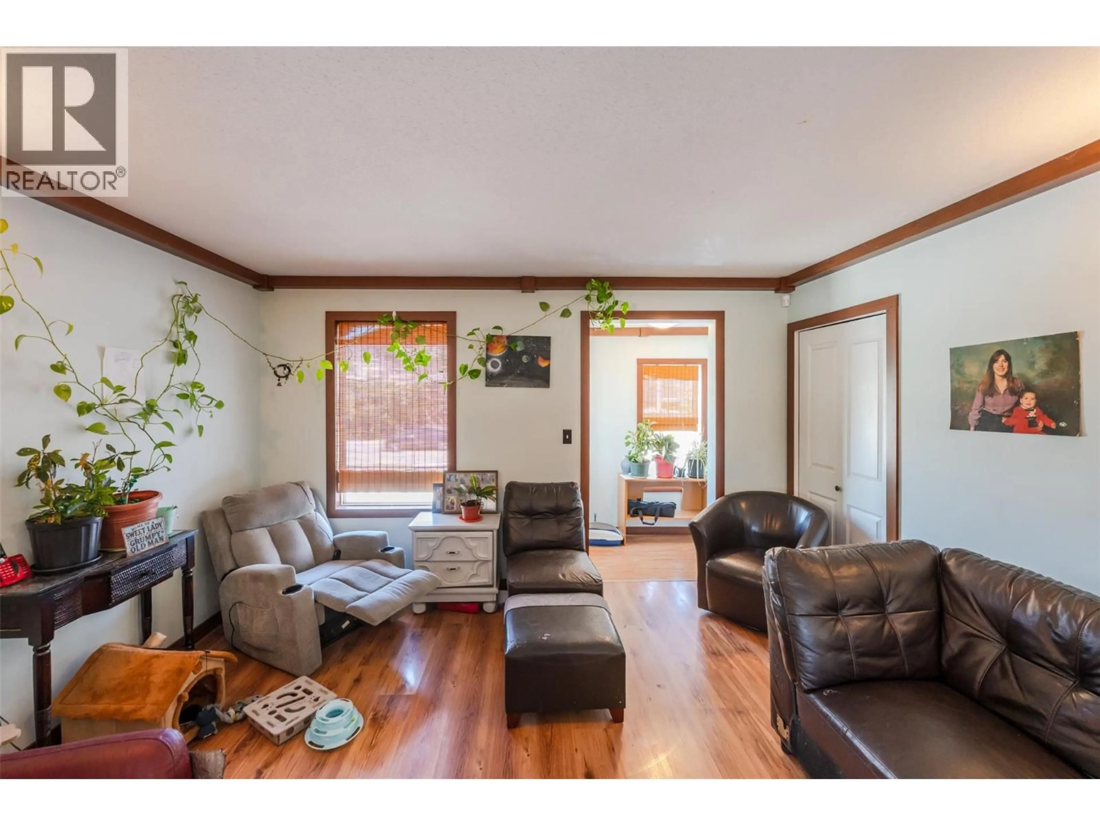 Living room with furniture, wood/laminate floor for 759 GOVERNMENT STREET, Penticton British Columbia V2A4T5