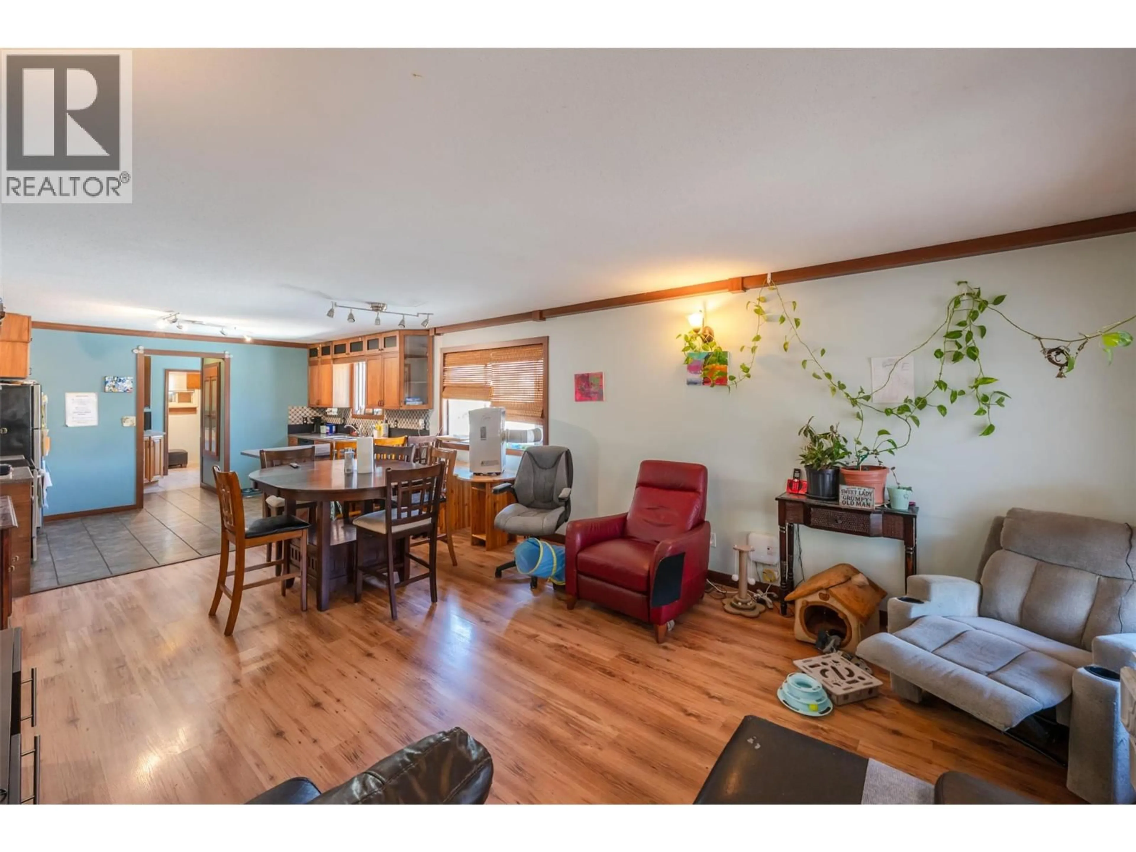 Living room with furniture, wood/laminate floor for 759 GOVERNMENT STREET, Penticton British Columbia V2A4T5