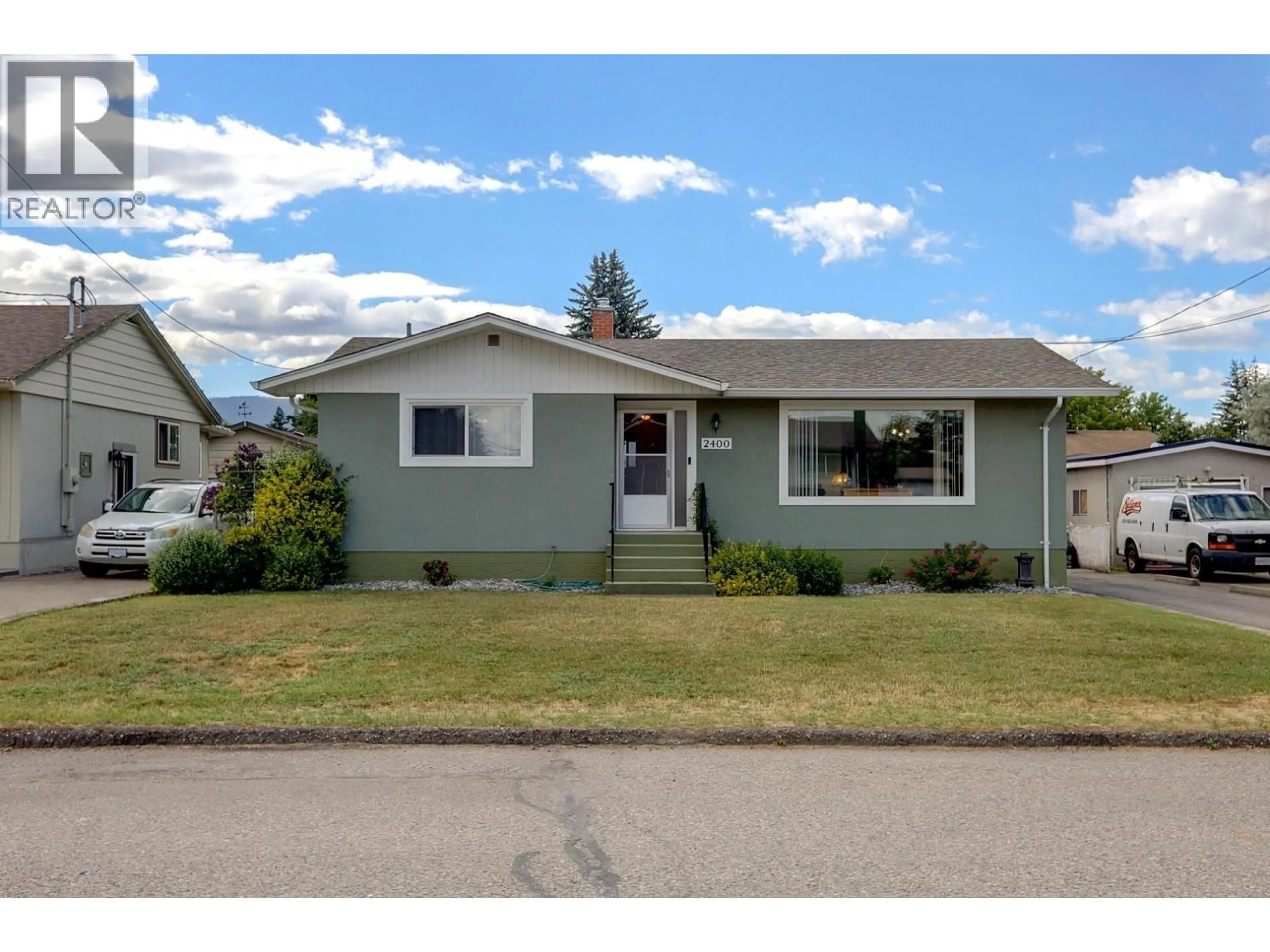Home with vinyl exterior material, street for 2400 44 AVENUE, Vernon British Columbia V1T3M1