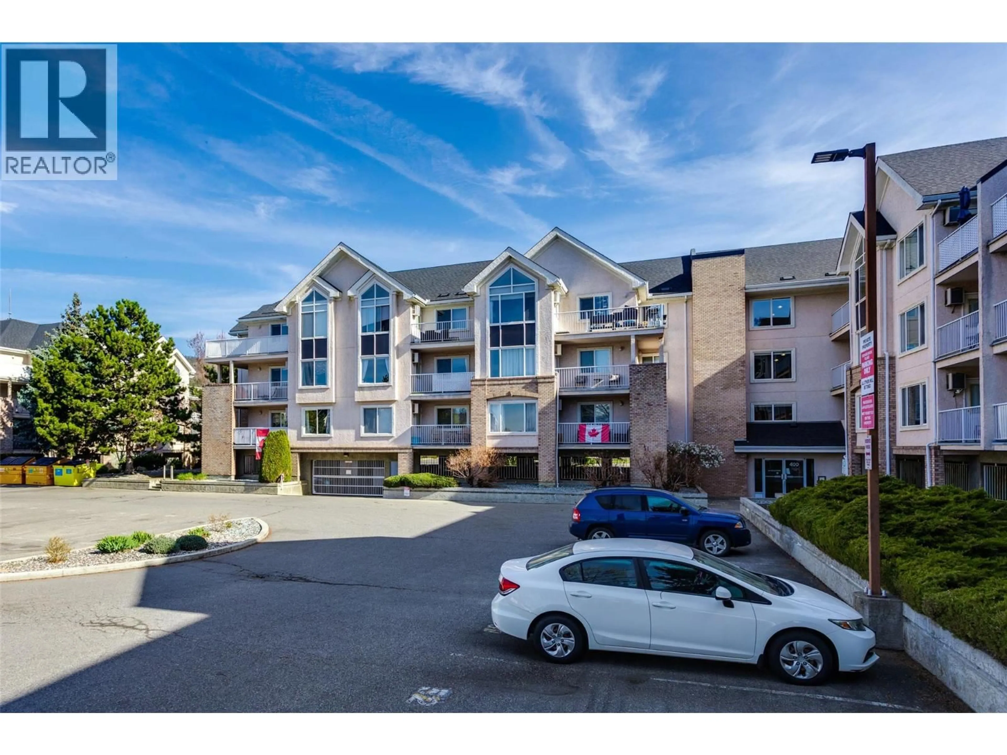 A pic from outside/outdoor area/front of a property/back of a property/a pic from drone, unknown for 110 - 400 SUTTON CRESCENT, Kelowna British Columbia V1V1Y3