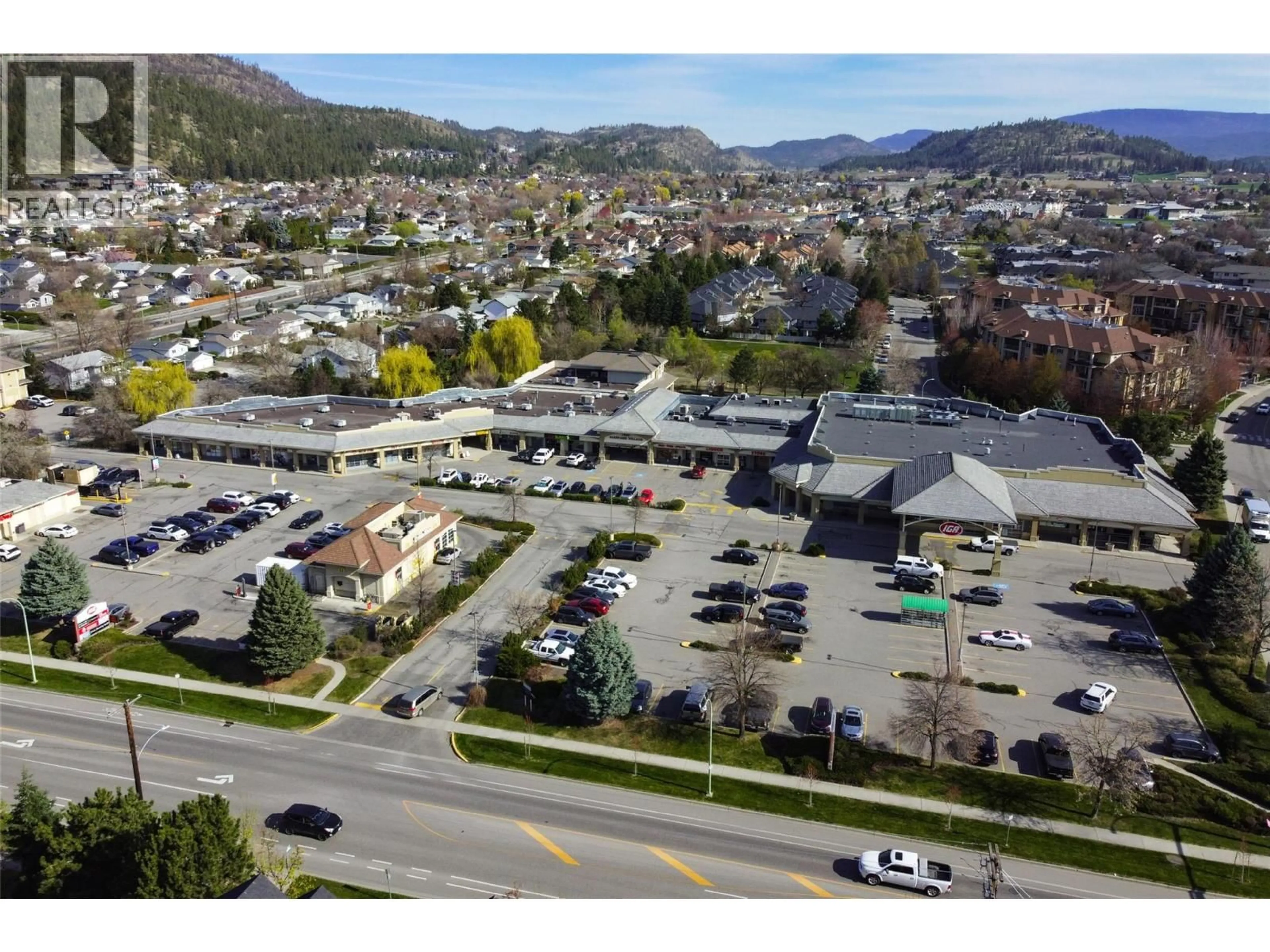A pic from outside/outdoor area/front of a property/back of a property/a pic from drone, mountain view for 110 - 400 SUTTON CRESCENT, Kelowna British Columbia V1V1Y3