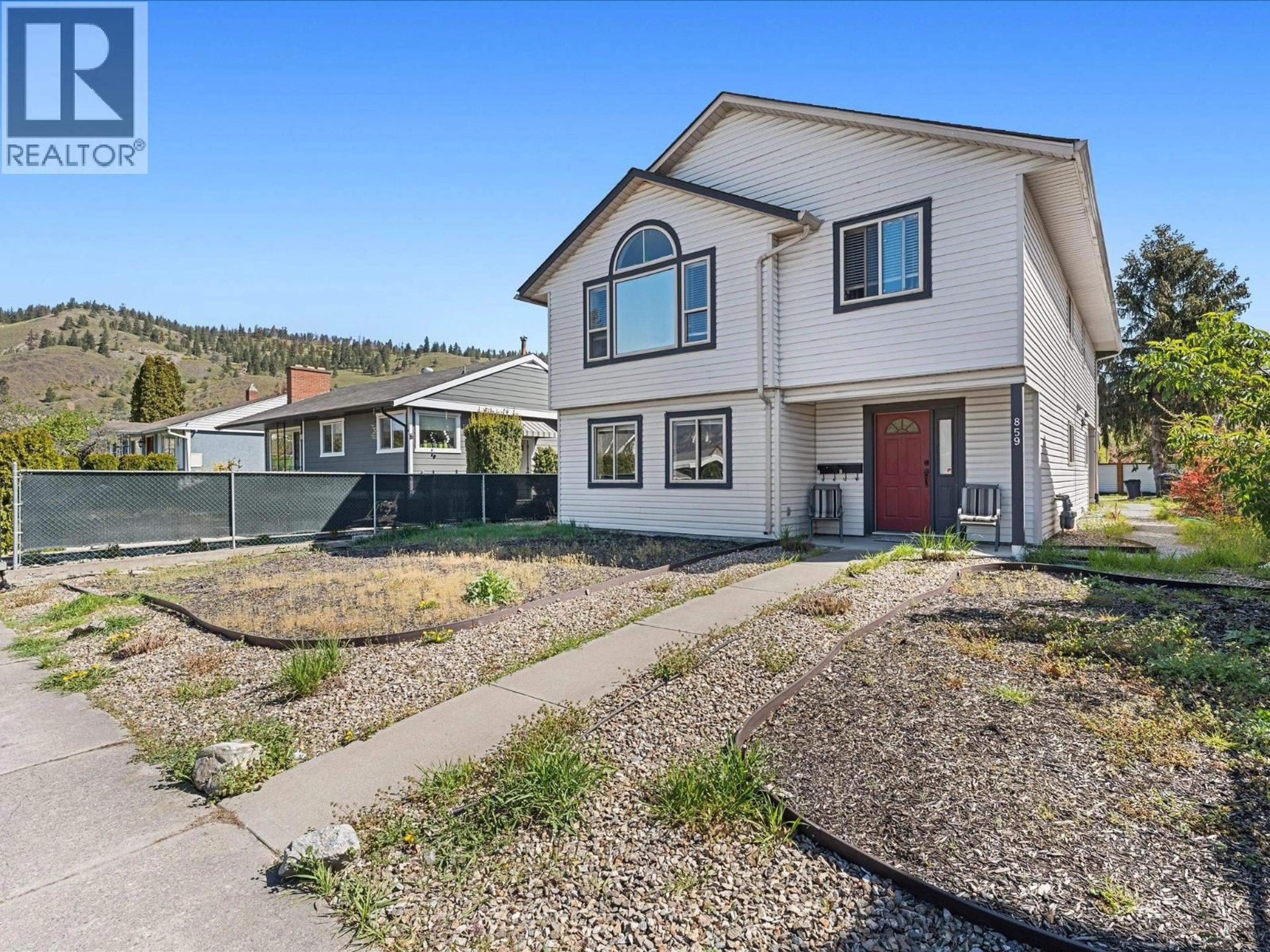 Home with vinyl exterior material, street for 859 RICHTER STREET, Kelowna British Columbia V1Y2J9